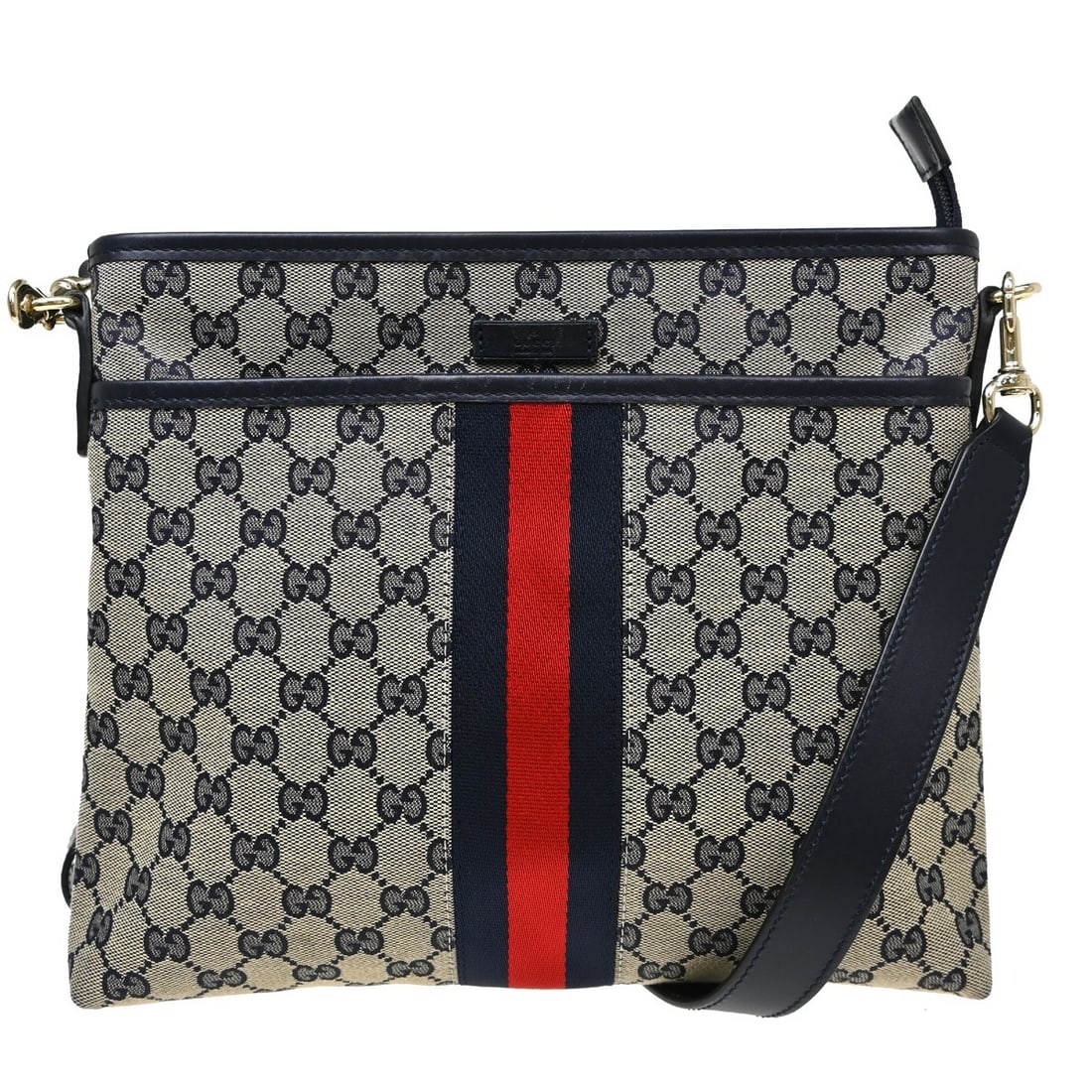 Gucci GG Navy Beige Canvas Leather Shoulder Bag 388926 204991: Gucci GG Navy Beige Canvas Leather Shoulder Bag 388926 204991 This Gucci GG shoulder bag features a beige and navy canvas exterior with leather accents, complemented by a blue leather shoulder strap. 