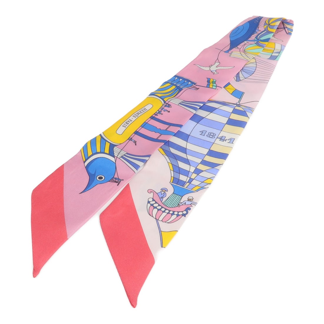 Hermes silk Twilly in pink blue yellow: Hermes silk Twilly in pink blue yellow This Hermes Twilly scarf is crafted from luxurious silk and features a vibrant combination of pink, blue, and yellow hues. Designed for women, this elegant acces