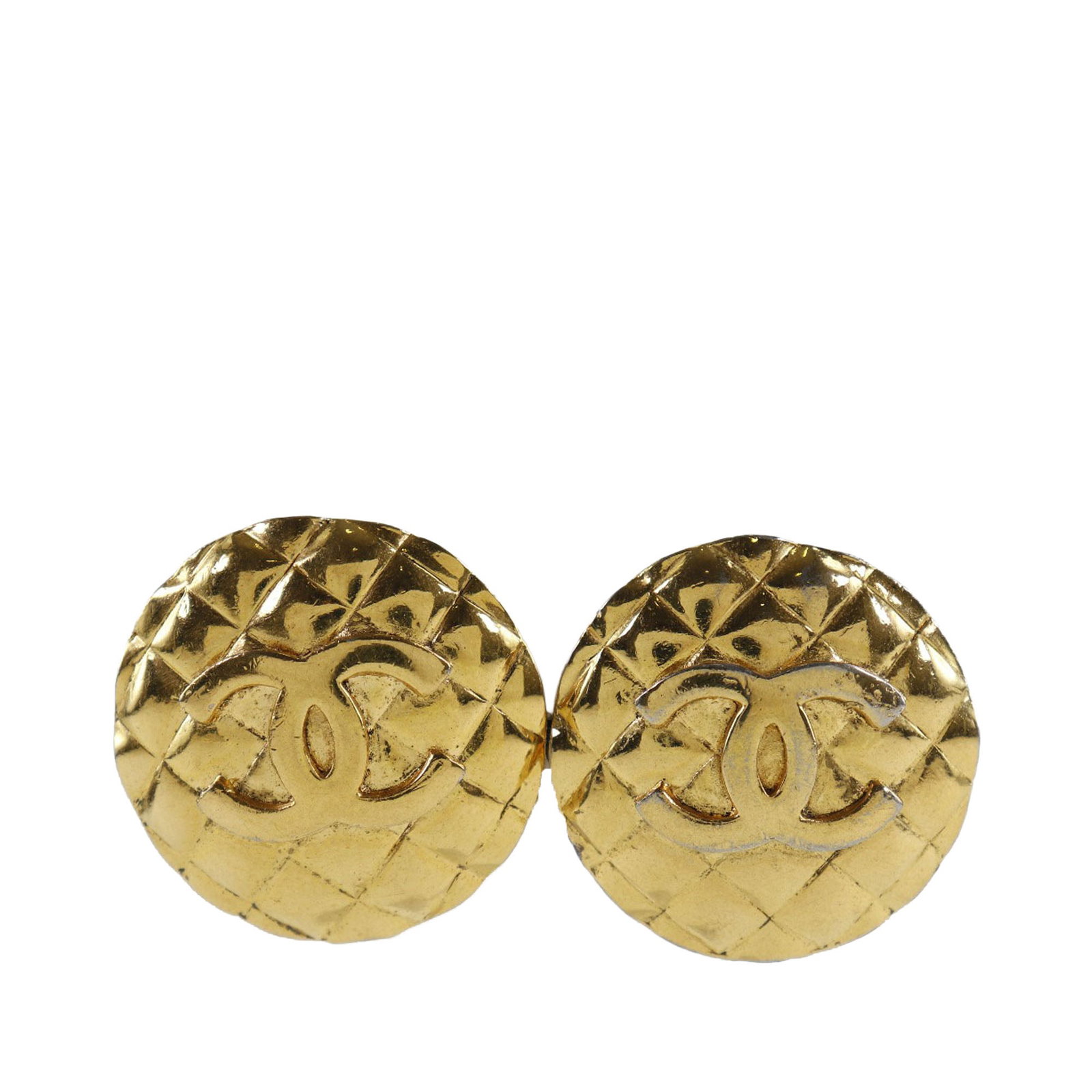 Chanel gold plated CC quilted round clip on earrings: Chanel gold plated CC quilted round clip on earrings These Chanel CC Quilted round clip-on earrings feature a gold plated metal body with the iconic quilted design. Made in France, they are designed f