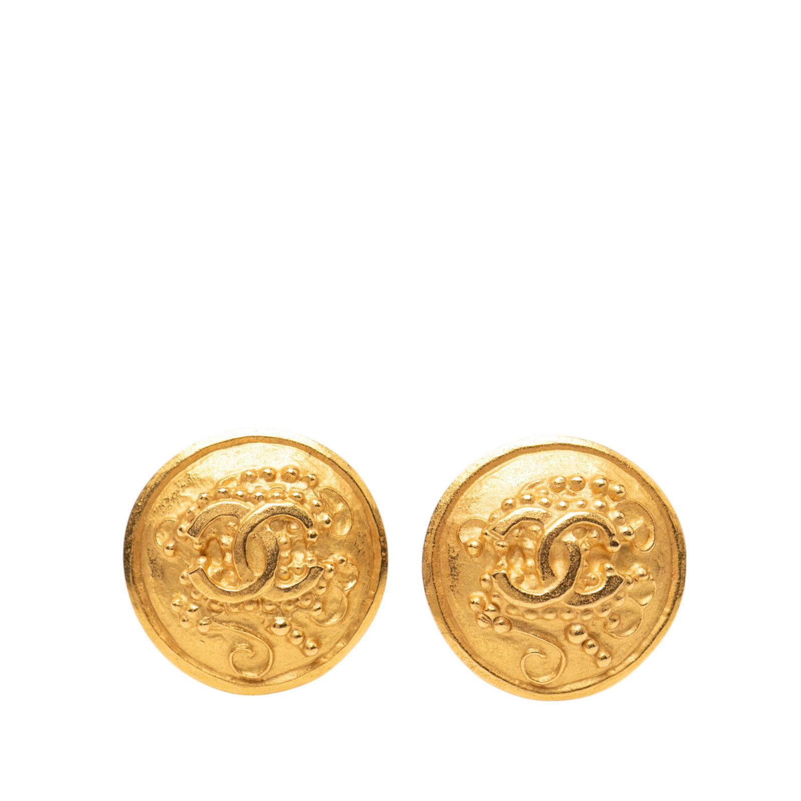 Chanel CC Motif Gold Plated Clip On Round Earrings: Chanel CC Motif Gold Plated Clip On Round Earrings These Chanel clip-on earrings feature a round design crafted from gold plated metal with the iconic CC motif and grapevine detailing. They are design