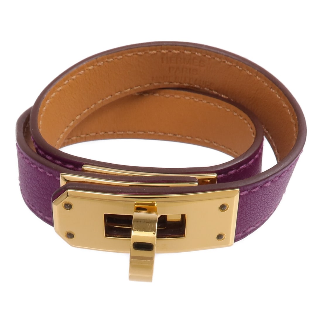 Hermes Kelly Double Tour Purple Calfskin Leather Bangle with Gold Hardware: Hermes Kelly Double Tour Purple Calfskin Leather Bangle with Gold Hardware This Hermes Kelly Double Tour bangle is crafted from Swift calfskin leather in a vibrant purple shade. The bangle features a 