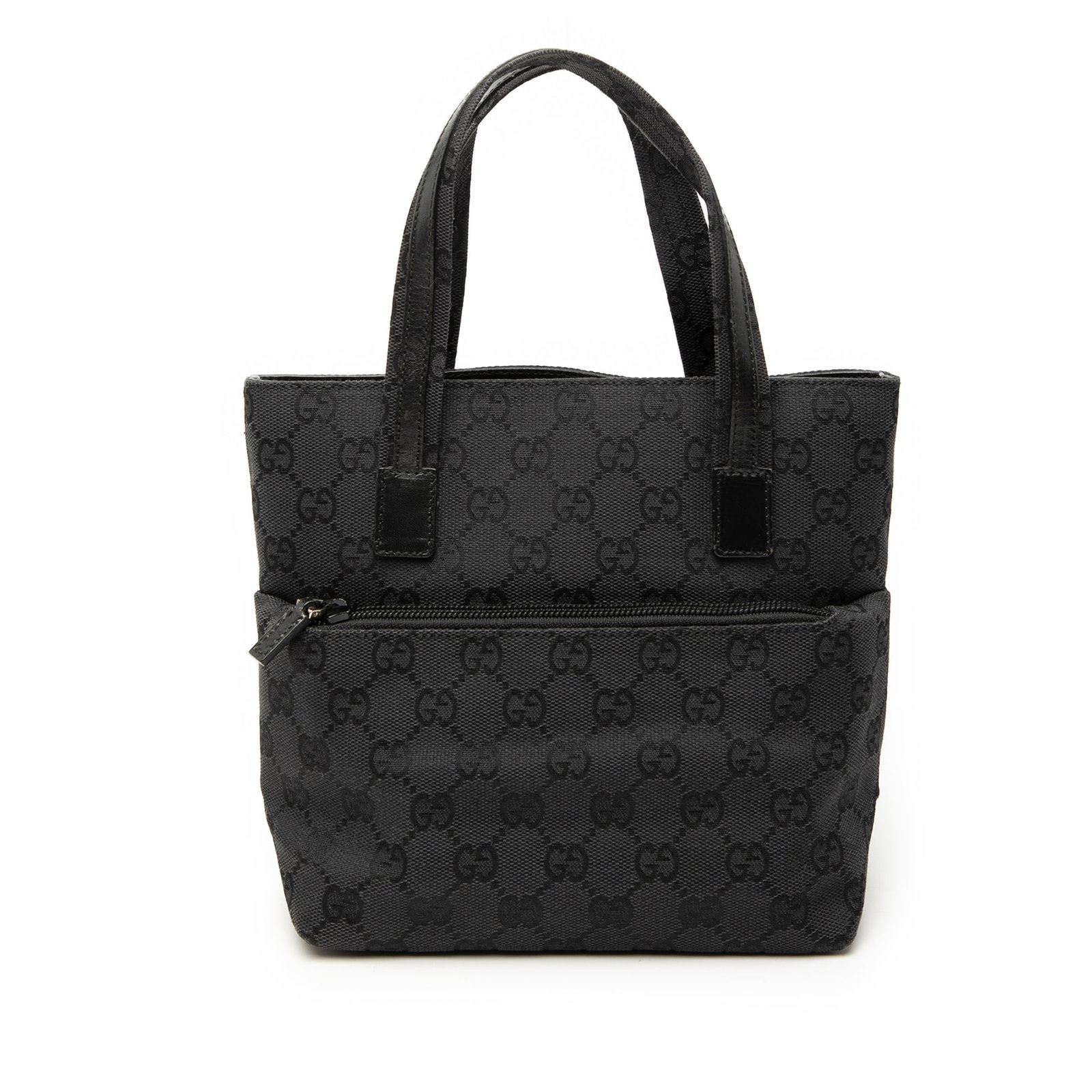 Black GG Canvas Shoulder Bag with Leather Trim by Gucci: Black GG Canvas Shoulder Bag with Leather Trim by Gucci This Gucci GG Canvas Handbag features a canvas body with flat leather handles, a top zip closure, an exterior front zip pocket, and an interior 