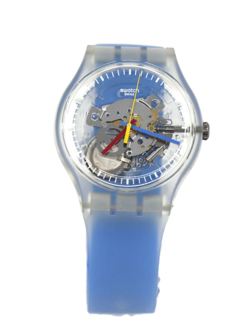 Swatch SUOK156 Blue Striped Skeleton Quartz Wristwatch with Box: Swatch SUOK156 Blue Striped Skeleton Quartz Wristwatch with Box This Swatch Blue Stripped Skeleton wristwatch features a plastic case and band, offering a lightweight and durable design. Powered by a 