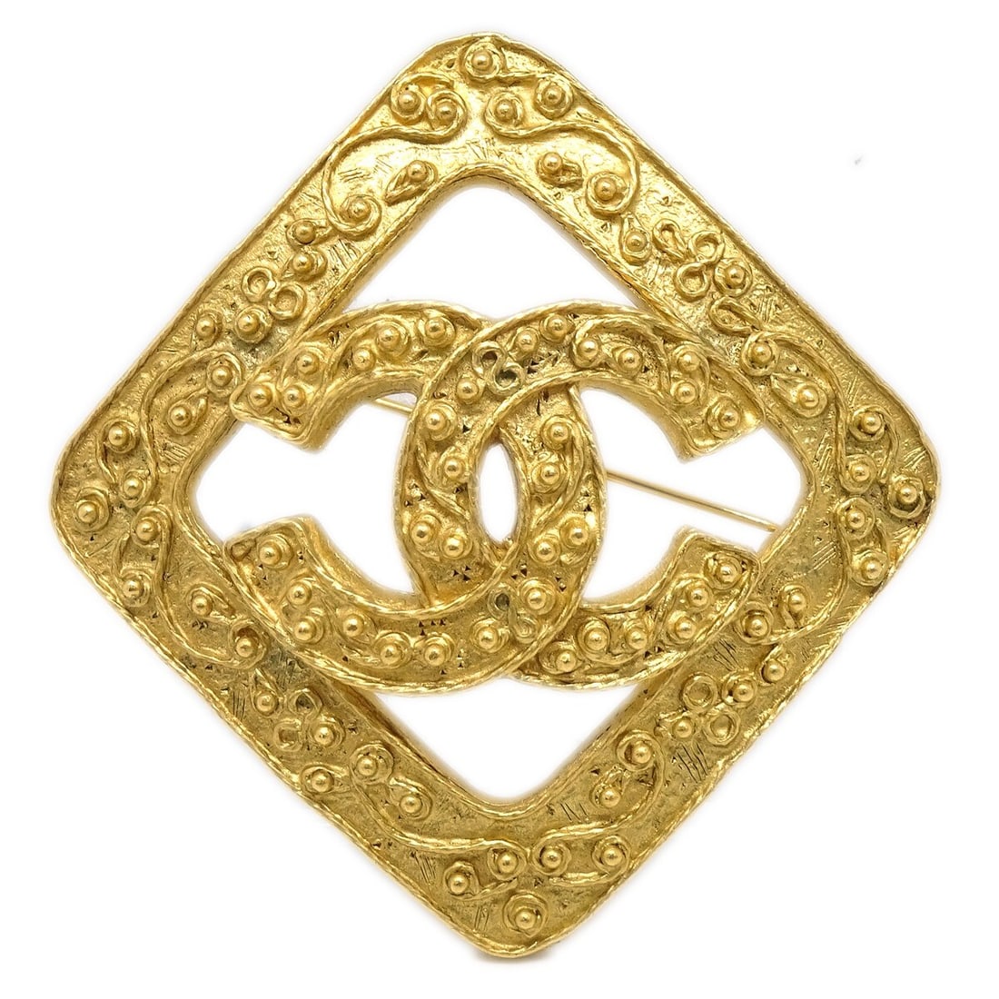 Chanel Gold-Plated Rhombus Brooch Pin 94A: Chanel Gold-Plated Rhombus Brooch Pin 94A This exquisite Chanel Rhombus Brooch Pin is a stunning accessory that adds a touch of elegance to any outfit. Crafted from high-quality gold-plated material, 