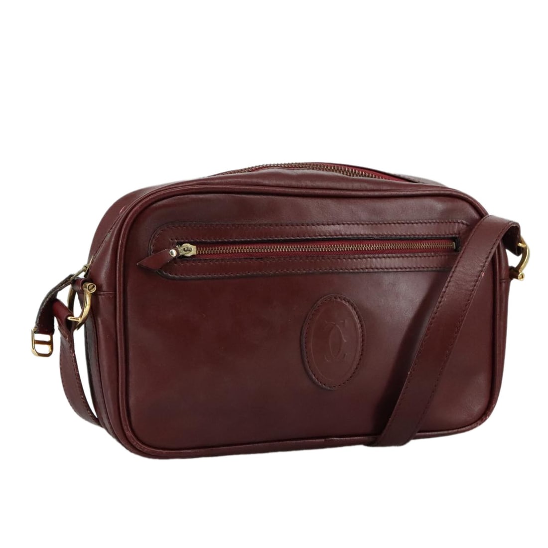 Cartier Burgundy Leather Must de Cartier Shoulder Bag: Cartier Burgundy Leather Must de Cartier Shoulder Bag This Must de Cartier shoulder bag is crafted from burgundy leather and features a classic design tailored for women. Made in France, the bag shows