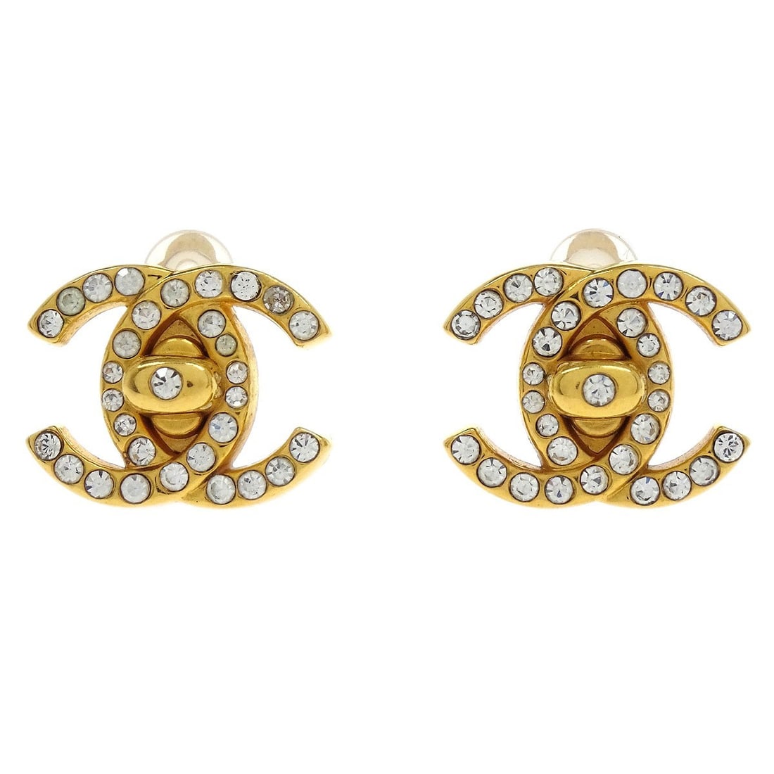 Chanel Gold Turnlock Clip-On Earrings with Rhinestones 96A: Chanel Gold Turnlock Clip-On Earrings with Rhinestones 96A Elevate your accessory collection with these stunning Chanel CC Turnlock Clip-On Earrings. Crafted from gold-plated material, these small ear