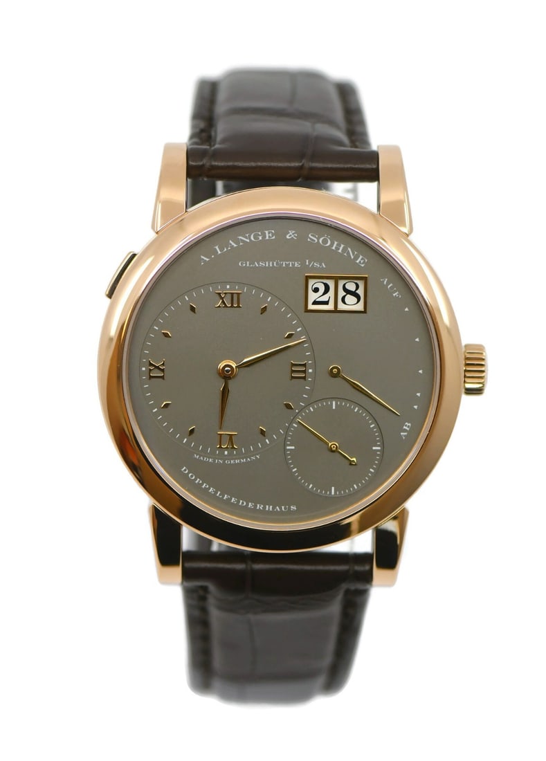 Lange 1 Rose Gold 101.033 Manual Wind Men's Wristwatch Brown Leather Strap: Lange 1 Rose Gold 101.033 Manual Wind Men's Wristwatch Brown Leather Strap This A. Lange & Sohne Lange 1 wristwatch features a 38.5mm polished 18K rose gold case paired with a smooth bezel and an exhi