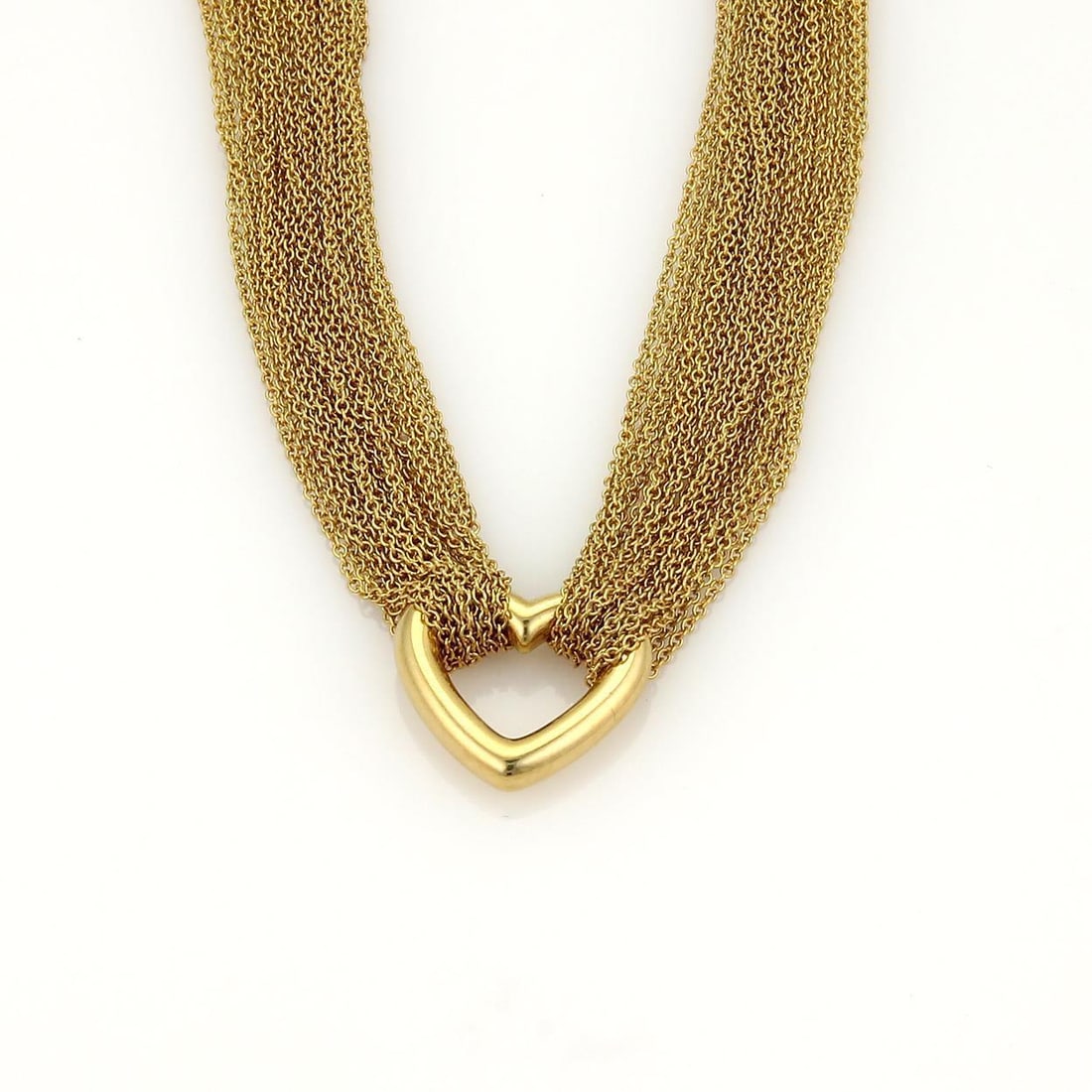 Tiffany & Co 18k Yellow Gold Heart Pendant Multichain Necklace: Tiffany & Co 18k Yellow Gold Heart Pendant Multichain Necklace This exquisite necklace from Tiffany & Co. features an elegant open heart pendant crafted from 18k yellow gold with a fine polished finis