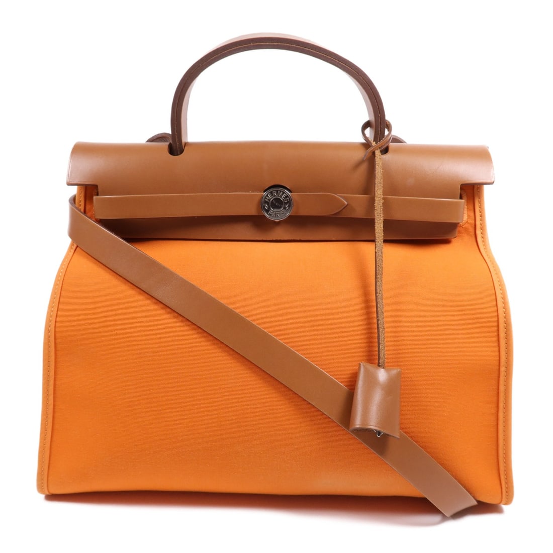 Hermes Herbag PM orange canvas 2 way shoulder bag: Hermes Herbag PM orange canvas 2 way shoulder bag This Hermes Herbag PM is a versatile 2-way shoulder bag crafted from durable orange canvas with gold-tone hardware. Designed for women, it features a 