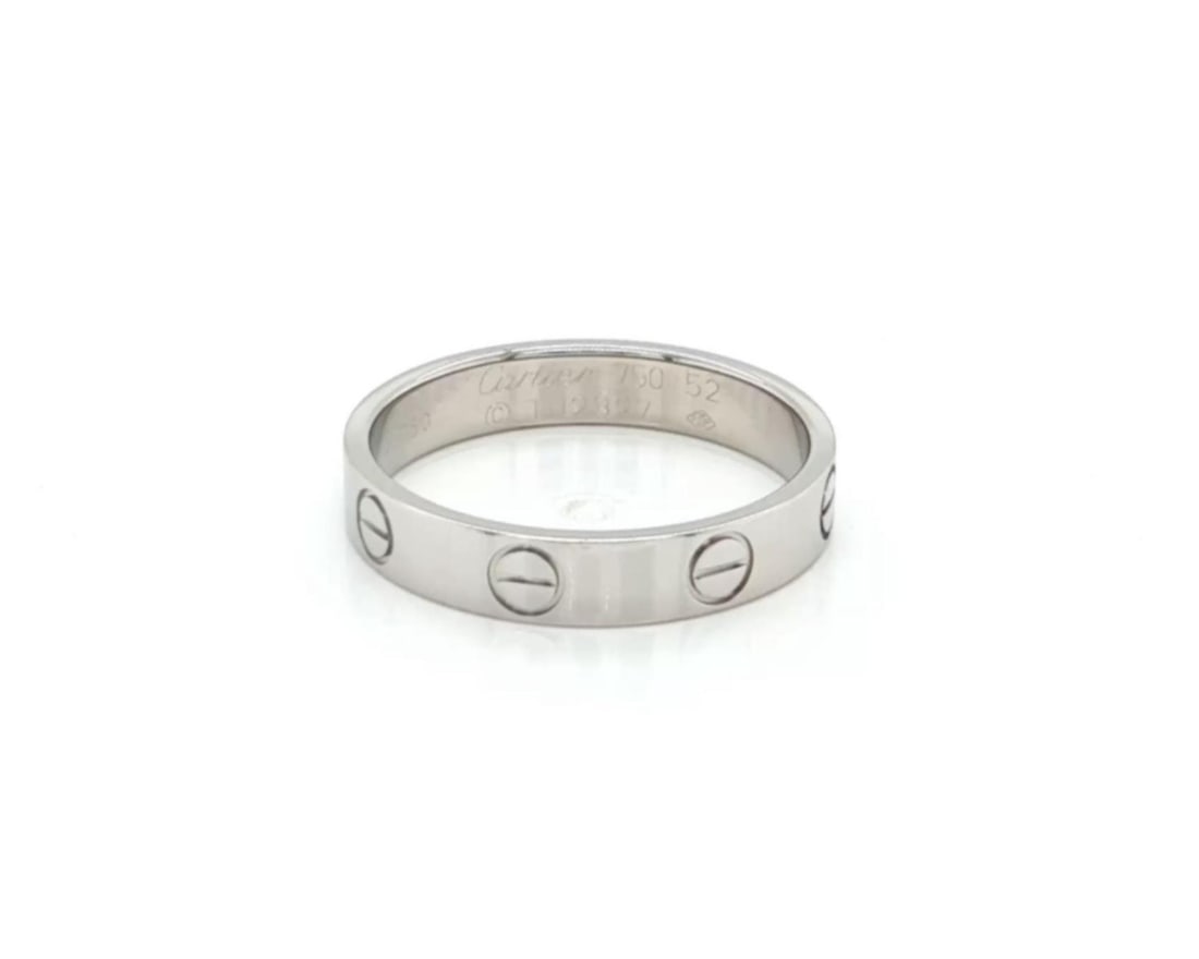 Cartier Love mini white gold band ring size 52 3.6 mm: Cartier Love mini white gold band ring size 52 3.6 mm This authentic Cartier Love mini band ring is crafted in 18k white gold and features the iconic screw motif from the renowned Love collection. The