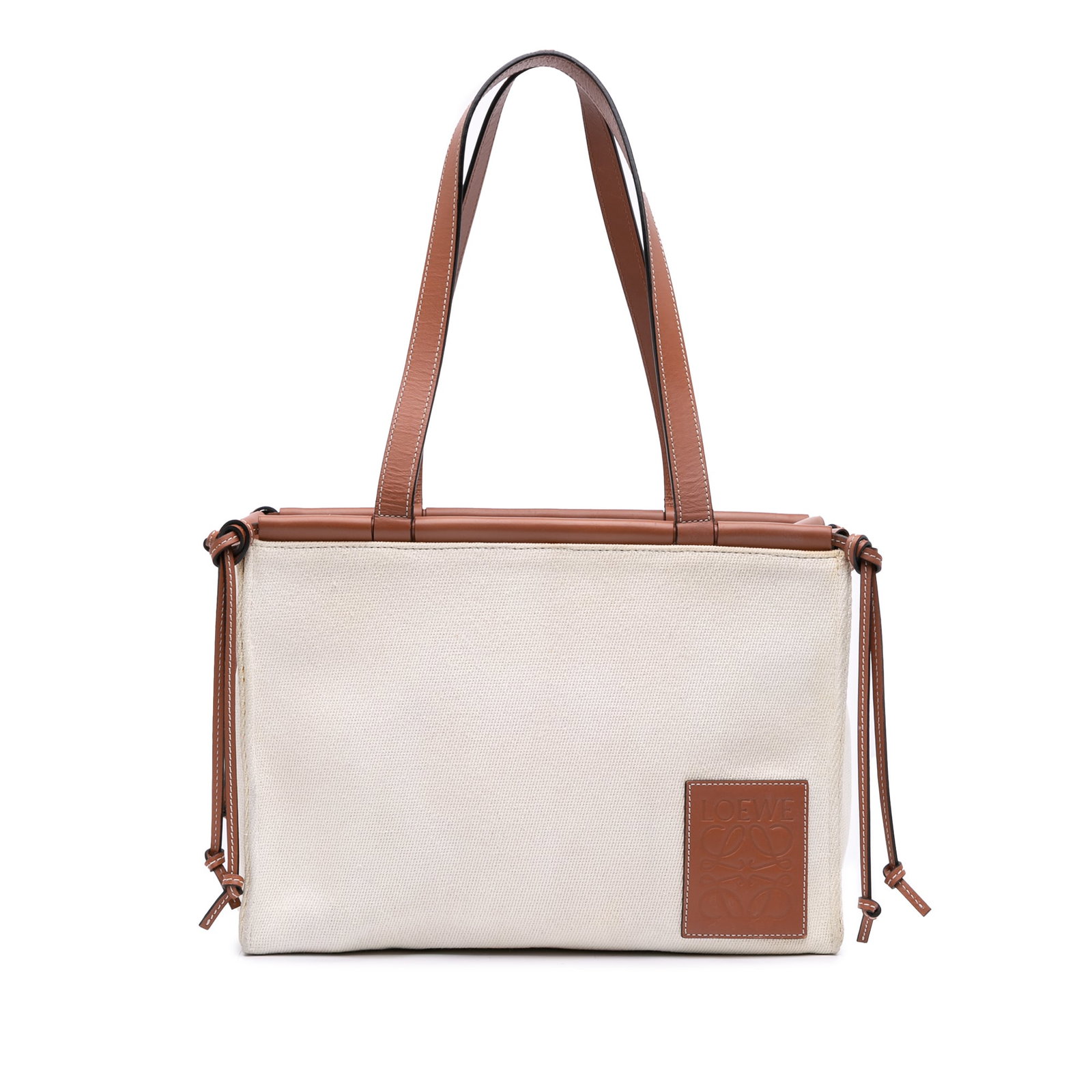 LOEWE Small Canvas Cushion Tote Brown Fabric Bag: LOEWE Small Canvas Cushion Tote Brown Fabric Bag The LOEWE Small Canvas Cushion Tote is a stylish and functional accessory perfect for everyday use. This tote bag features a durable canvas body accent