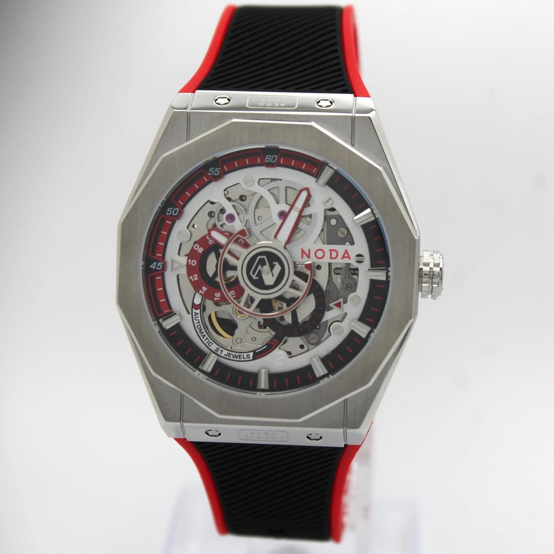 Aero Series-1 43mm Skeleton Dial Automatic Wristwatch with Red Accents: Aero Series-1 43mm Skeleton Dial Automatic Wristwatch with Red Accents This Noda Aero Series-1 wristwatch features a 43 mm brushed stainless steel octagonal case with a striking red and silver skeleto