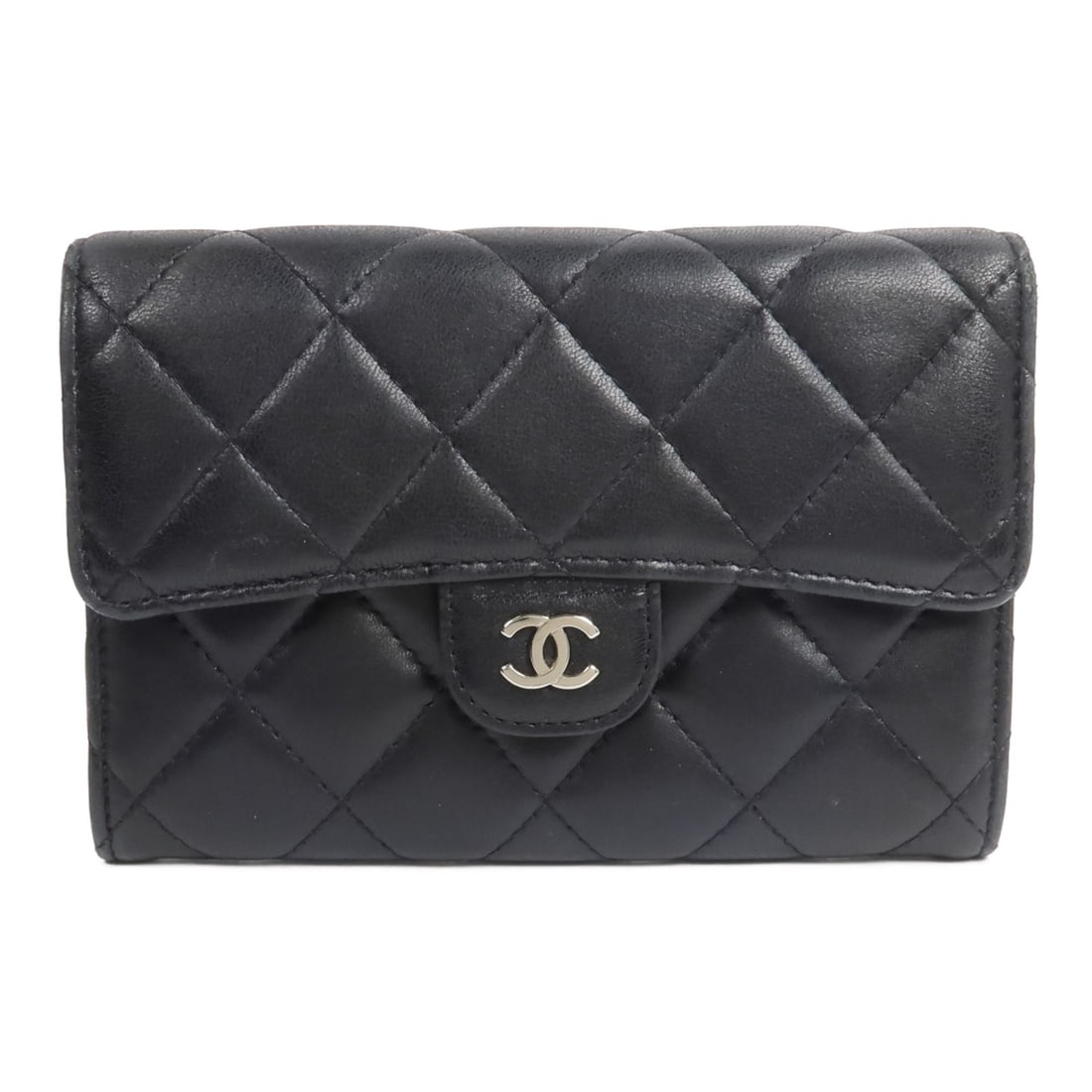 CHANEL Black Lambskin Bi Fold CC Wallet: CHANEL Black Lambskin Bi Fold CC Wallet This CHANEL bi-fold wallet is crafted from luxurious black lambskin leather and designed for women. Featuring a classic bi-fold style, it offers both elegance a