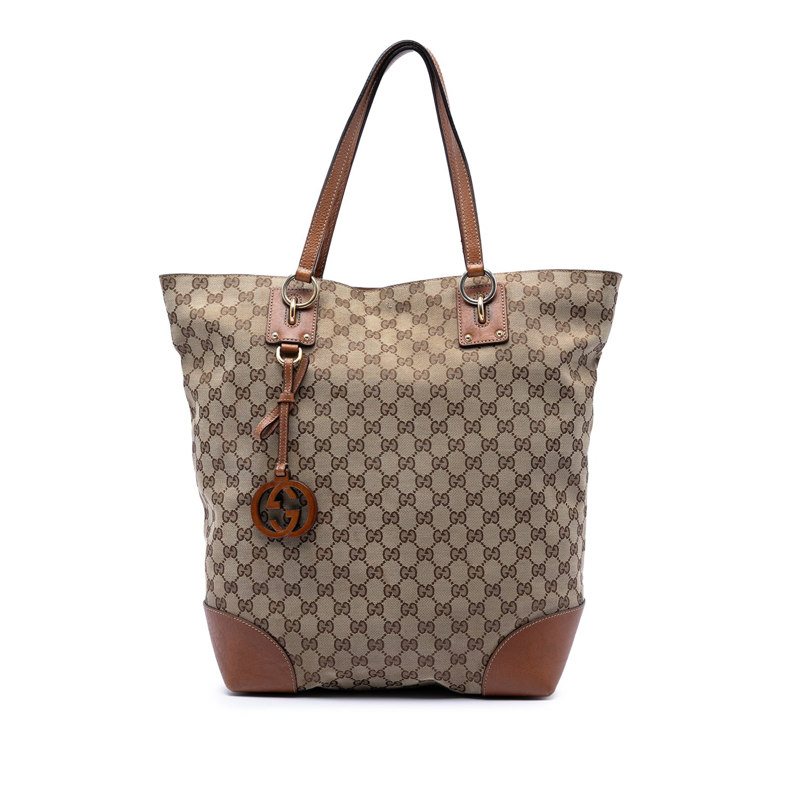 Gucci GG Canvas Beige Tote with Leather Trim: Gucci GG Canvas Beige Tote with Leather Trim This Gucci Large GG Canvas GG Charm Tote features a durable canvas body with leather trim and a signature GG charm. It is designed with flat leather handle