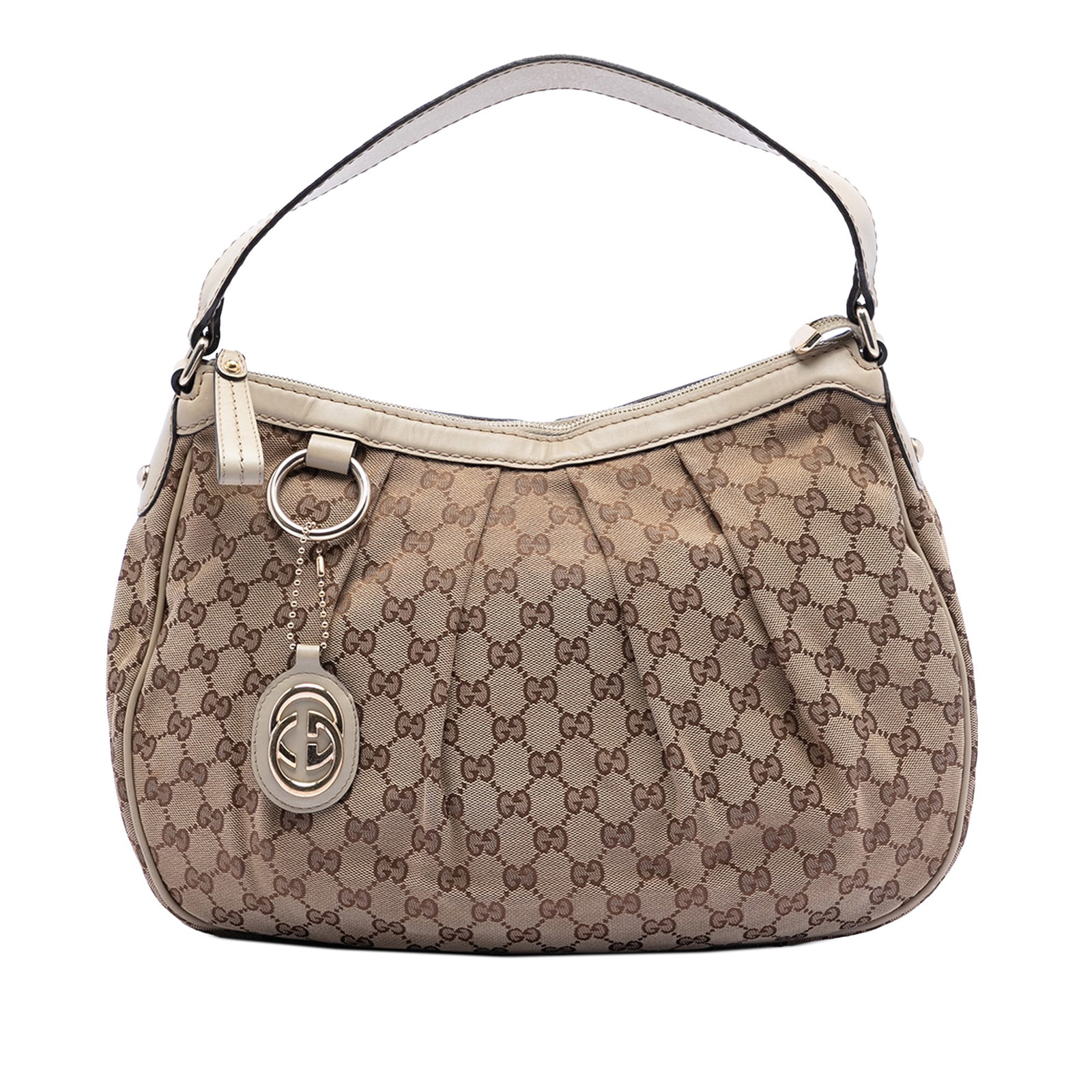 Gucci Sukey Beige Canvas Shoulder Bag with Leather Trim: Gucci Sukey Beige Canvas Shoulder Bag with Leather Trim The Gucci GG Canvas Sukey Shoulder Bag features a canvas body with leather trim, a flat leather strap, a top zip closure, and both interior zip 