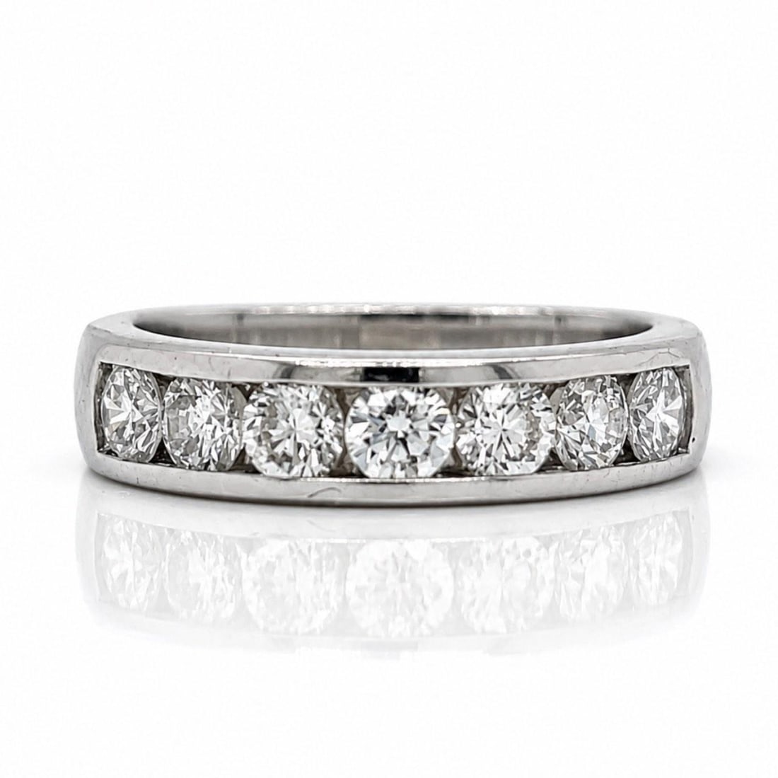 Platinum Diamond Anniversary Ring 1.11 Ct Size 6.5: Platinum Diamond Anniversary Ring 1.11 Ct Size 6.5 This platinum D-shape anniversary band features seven diamonds with a total weight of 1.11 carats. The diamonds are F-G in color and have VVS-VS clar