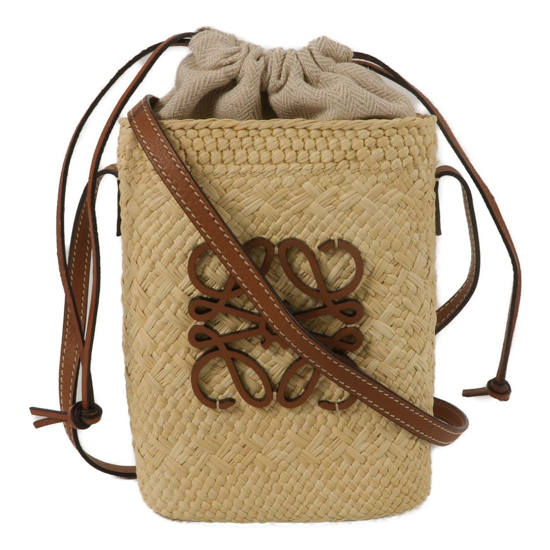 LOEWE Iraca Palm Square Pocket Beige Shoulder Bag: LOEWE Iraca Palm Square Pocket Beige Shoulder Bag This LOEWE Square Pocket Shoulder Bag is crafted from Iraca palm in a beige color, offering a distinctive and natural look. Designed for women, it fea