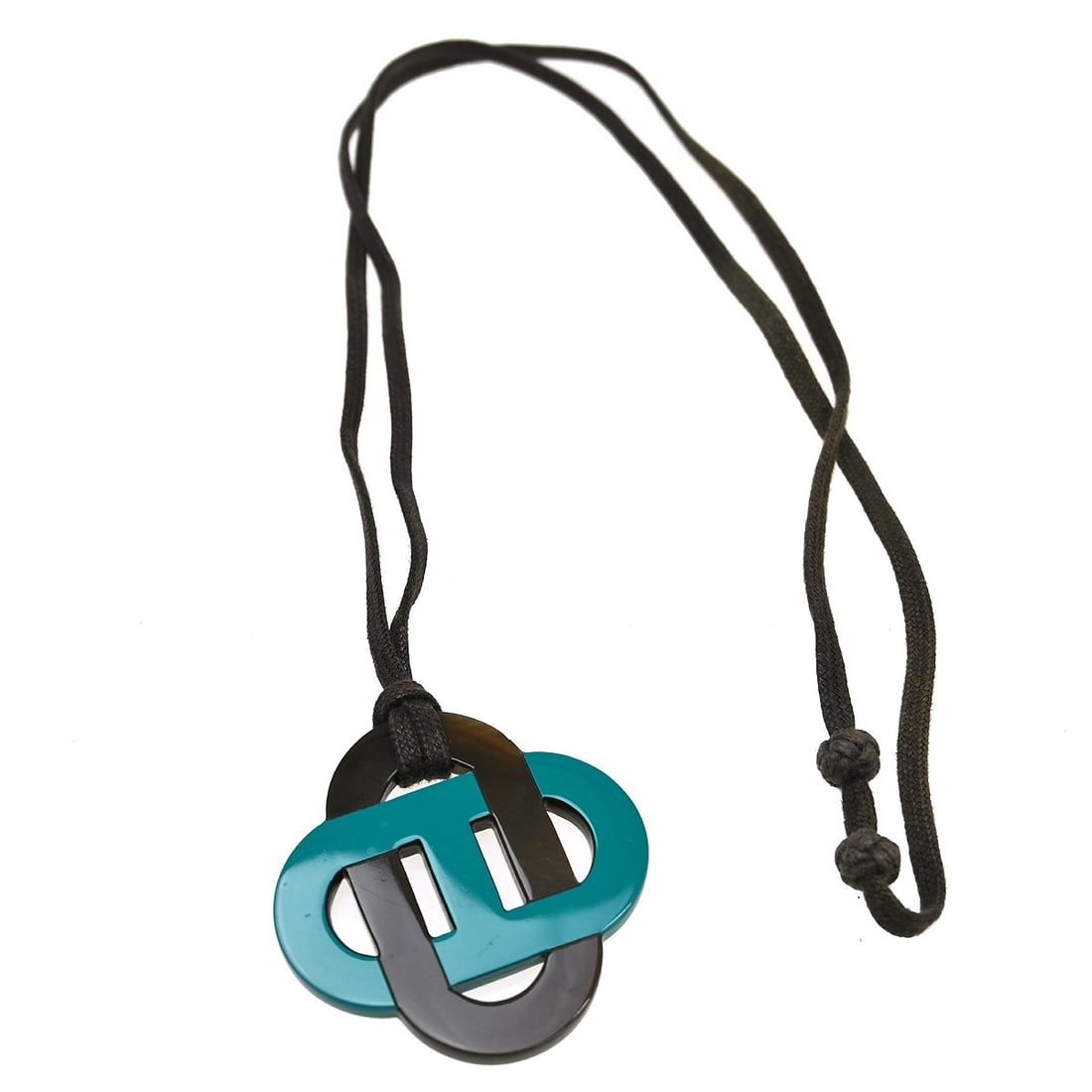Hermes Isatis Black Horn Pendant Necklace Adjustable: Hermes Isatis Black Horn Pendant Necklace Adjustable This Hermes Isatis pendant necklace features a striking black buffalo horn pendant paired with a leather cord. The adjustable design allows for a c
