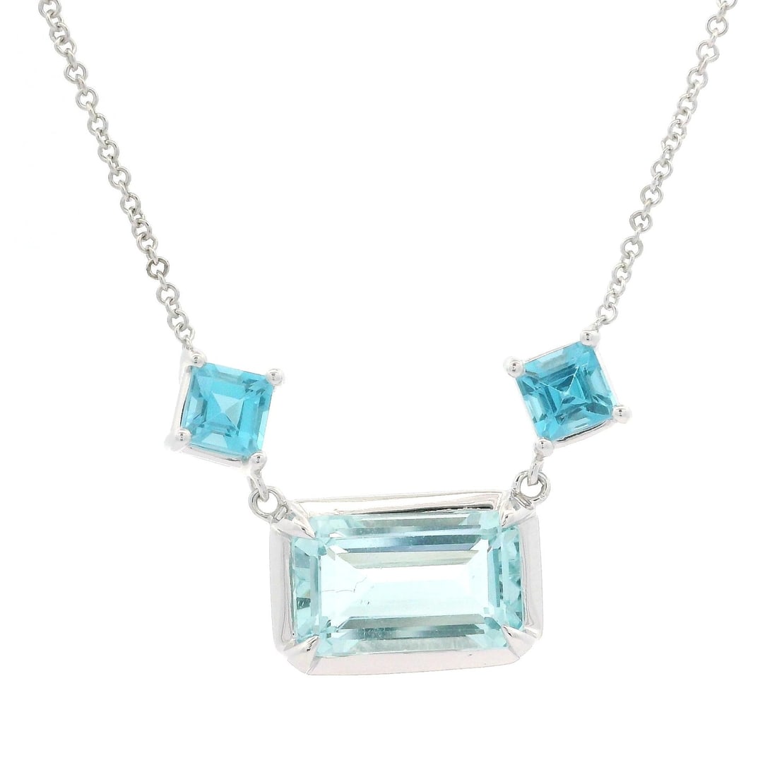 14k White Gold 4.39ct Aquamarine Blue Topaz Pendant Necklace: 14k White Gold 4.39ct Aquamarine Blue Topaz Pendant Necklace This stunning pendant necklace features a captivating design crafted from 14k white gold. It showcases a beautiful emerald cut aquamarine w