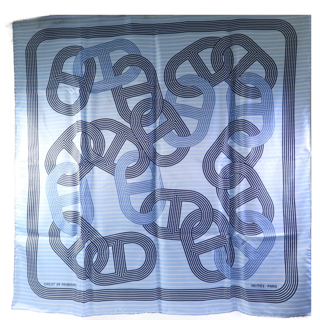 Blue and White Silk Scarf by Hermes 90x90 cm: Blue and White Silk Scarf by Hermes 90x90 cm This Hermes scarf features a blue and white design crafted from luxurious silk. Made in France, it offers a classic and elegant look suitable for various o