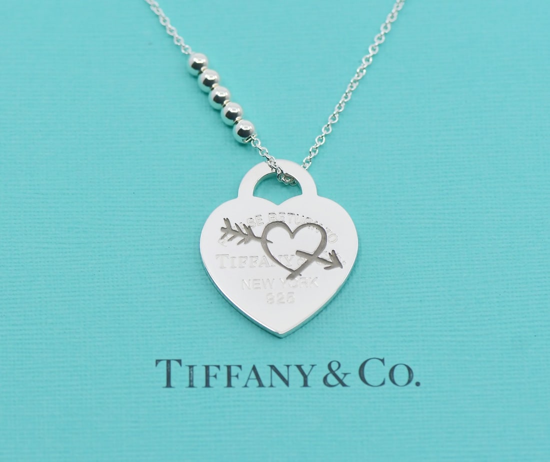 Tiffany & Co Return To Heart Arrow Sterling Silver Pendant Necklace: Tiffany & Co Return To Heart Arrow Sterling Silver Pendant Necklace Embrace love and elegance with the Tiffany & Co. Return To Heart Arrow Sterling Silver Necklace. This stunning pendant necklace is c