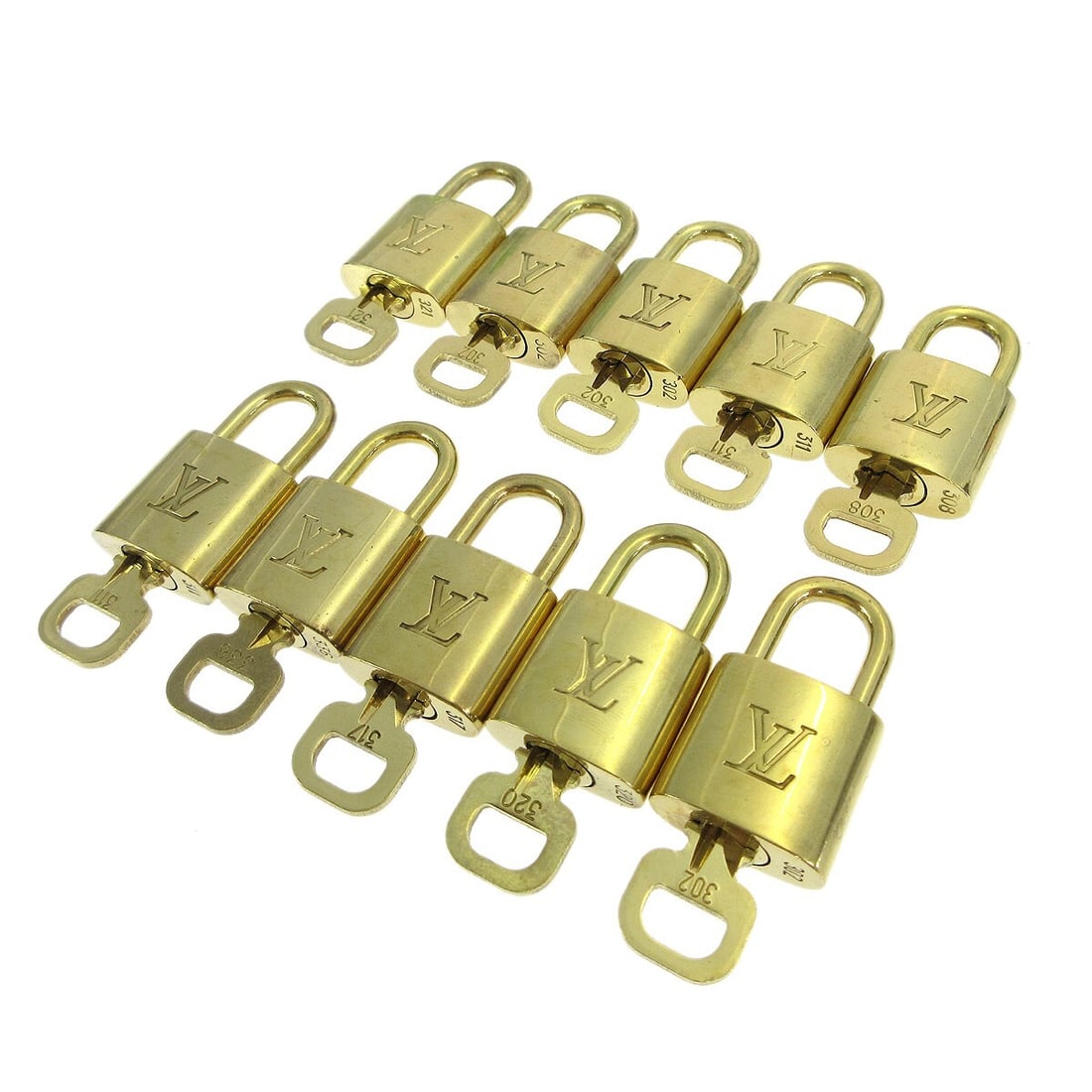 Louis Vuitton gold-tone padlock key charm set of 10: Louis Vuitton gold-tone padlock key charm set of 10 This is a 10-piece set of Louis Vuitton padlocks and keys designed as bag accessories or charms. Each padlock features a gold-tone metal finish with
