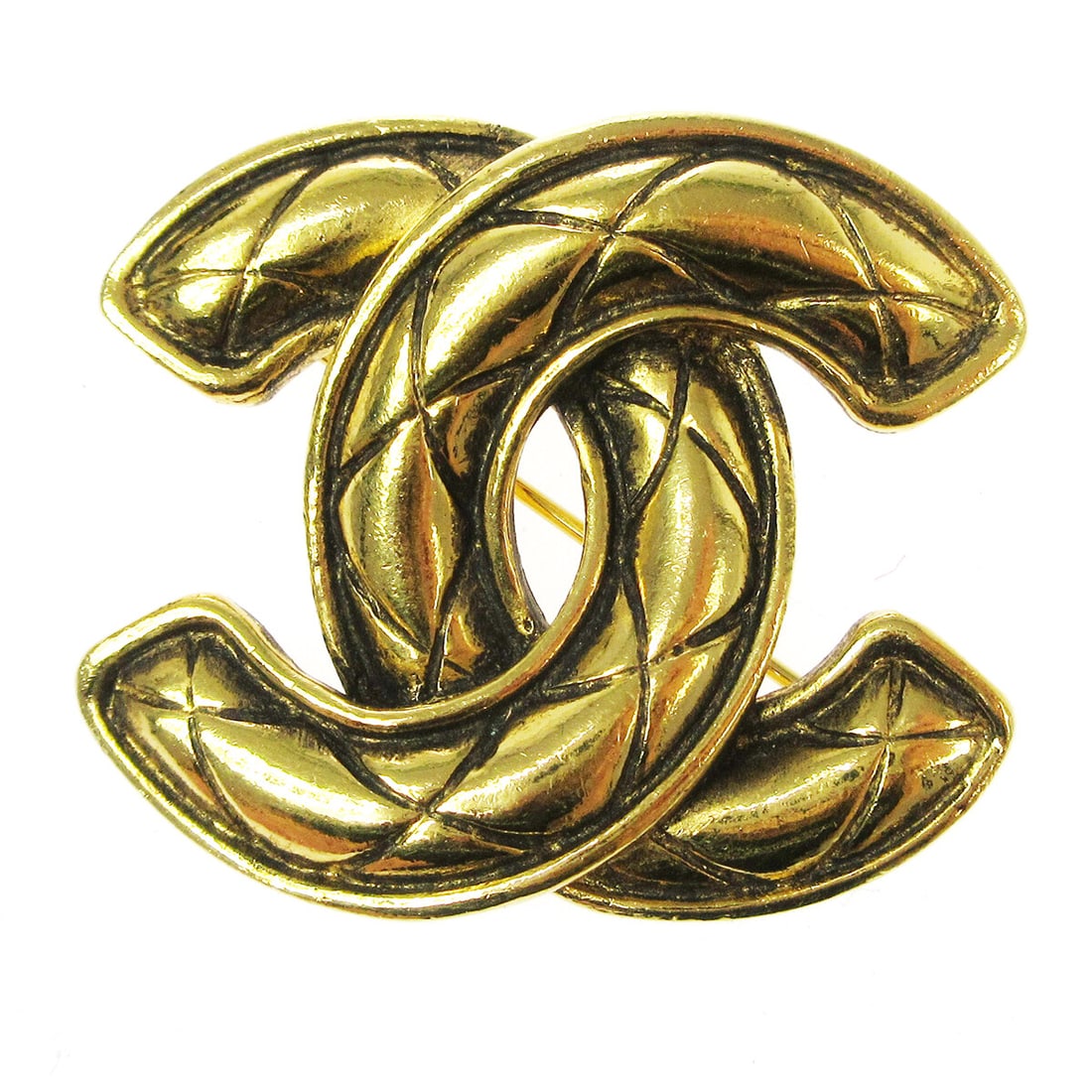 Chanel Gold-tone Quilted CC Logo Brooch Pin 1153: Chanel Gold-tone Quilted CC Logo Brooch Pin 1153 Add a touch of luxury to your outfit with this stunning Chanel Quilted CC Brooch Pin. Crafted in a rich gold-tone metal, this brooch features the iconi