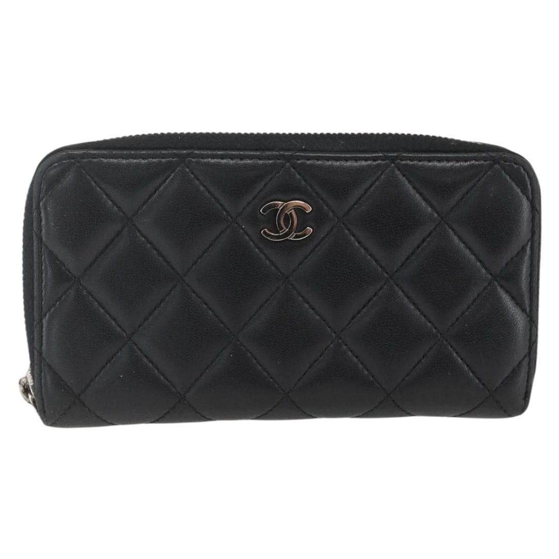 Black Quilted Lambskin Organizer Wallet by Chanel Zip Around: Black Quilted Lambskin Organizer Wallet by Chanel Zip Around This pre-owned Chanel Zip Around Organizer Wallet is crafted from black quilted lambskin leather designed for women. It features a zip-arou