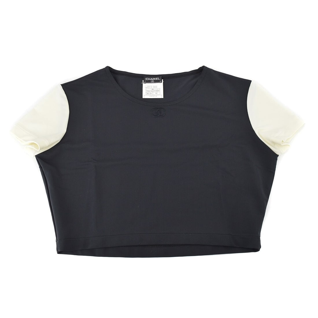 Vintage Chanel Black Cropped T-shirt 90s Style Short Sleeve: Vintage Chanel Black Cropped T-shirt 90s Style Short Sleeve This vintage Chanel cropped t-shirt is a stylish tribute to the 90s, featuring a classic black color that pairs effortlessly with any outfit