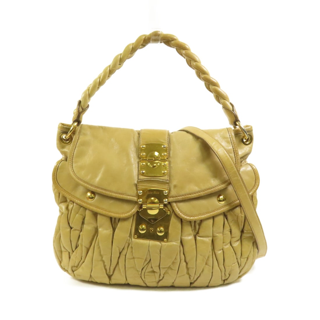Beige Calfskin Leather Miu Miu Two Way Shoulder Bag with Gold Hardware: Beige Calfskin Leather Miu Miu Two Way Shoulder Bag with Gold Hardware This Miu Miu 2-way shoulder bag is crafted from beige calfskin leather and features a versatile design for convenient carrying. M