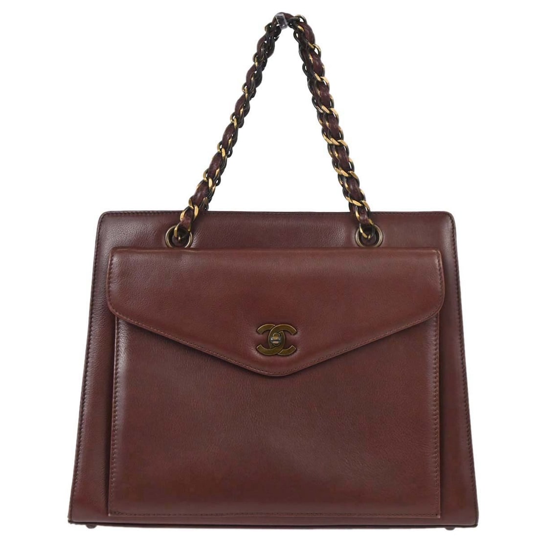 Chanel Brown Leather Tote with Inner Pockets: Chanel Brown Leather Tote with Inner Pockets This Chanel handbag is crafted from brown calfskin leather and features a medium-sized tote design. It includes inner pockets for added organization and is