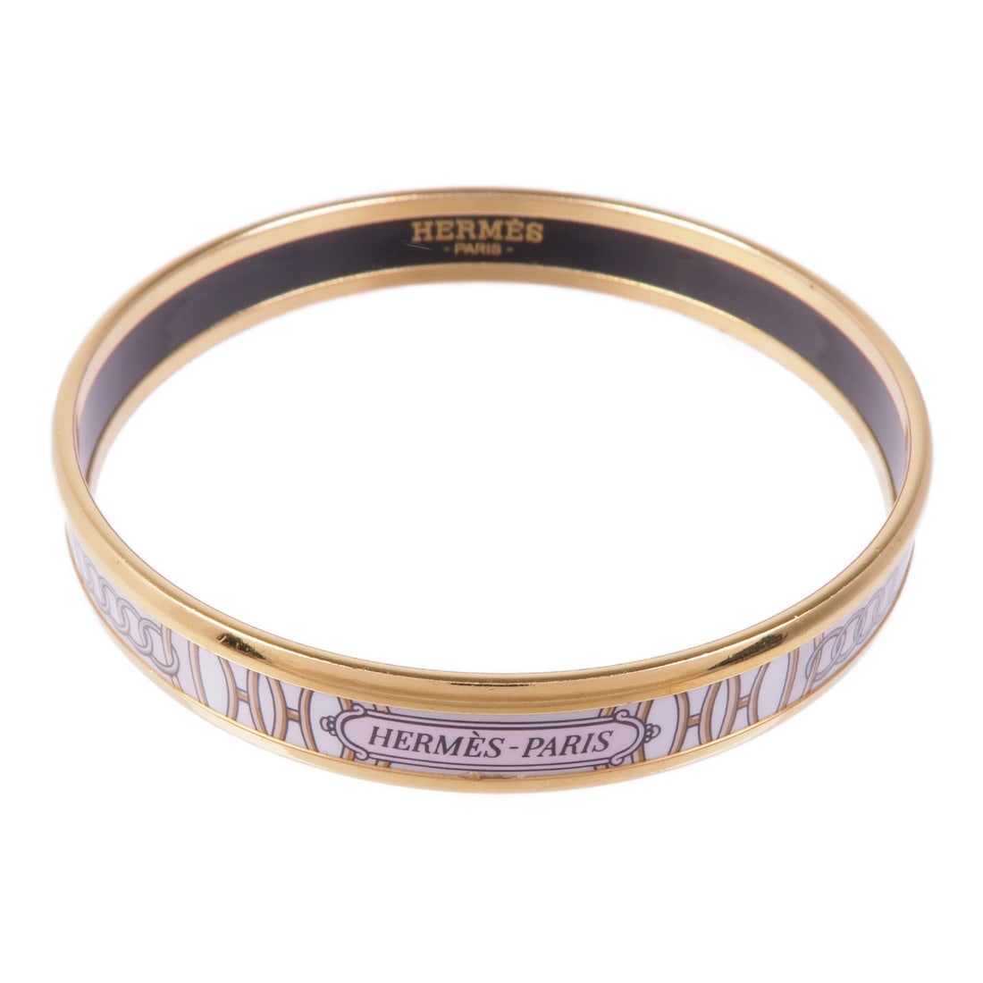 Hermes White Enamel Gold Tone Bangle Bracelet: Hermes White Enamel Gold Tone Bangle Bracelet This Hermes bangle bracelet features a sleek white enamel design complemented by metal accents. Crafted in France, it is designed for women and showcases 