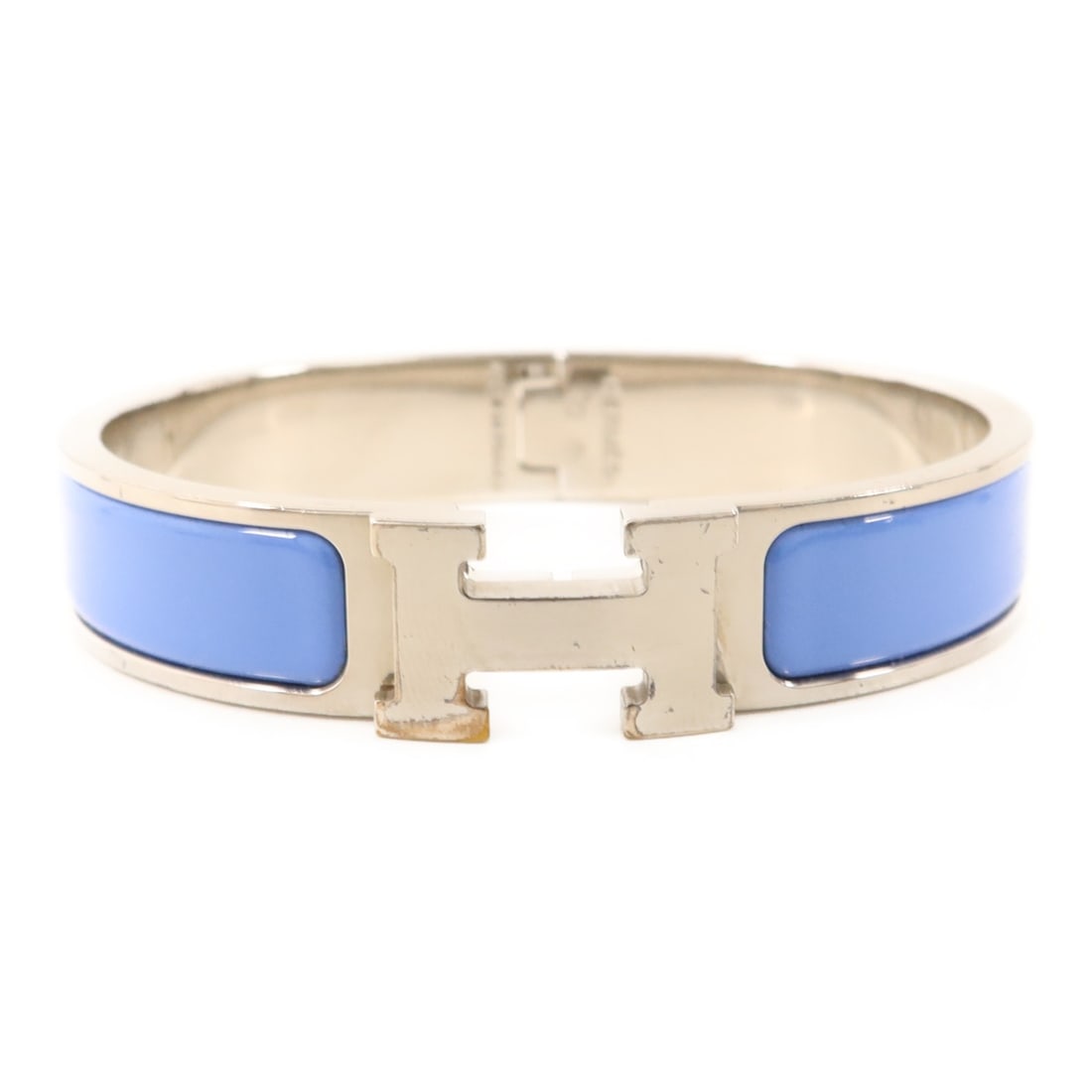 Blue Clic H Bangle Bracelet with Palladium Hardware by Hermes: Blue Clic H Bangle Bracelet with Palladium Hardware by Hermes This women's bangle from Hermes features a blue enamel design with palladium-plated metal hardware. The piece is crafted in France and is 