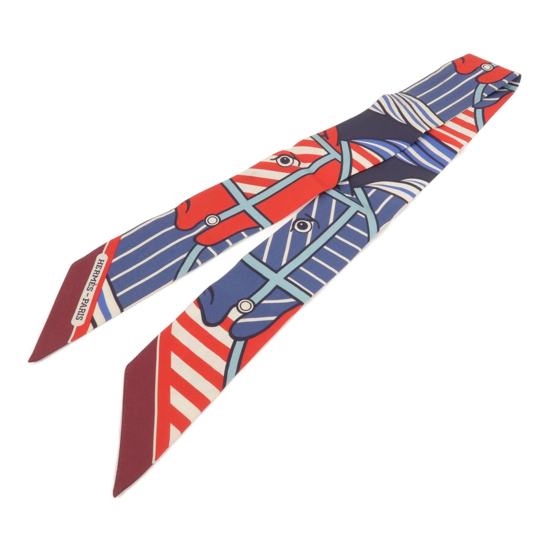 Hermes Twilly silk blue red women's scarf: Hermes Twilly silk blue red women's scarf This Hermes Twilly scarf is crafted from silk and features a blue and red color scheme. Designed for women, it offers a stylish accessory option with