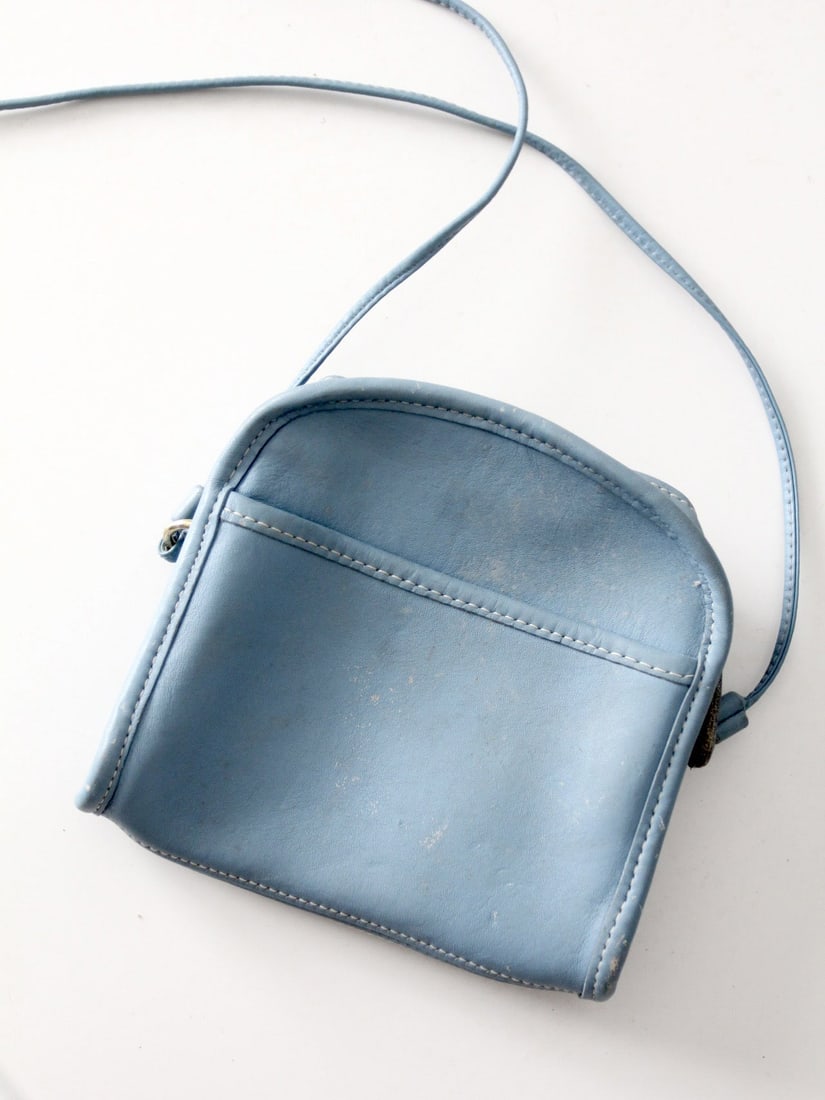 Coach 1990s Blue Leather Mini Shoulder Bag with Zip Top: Coach 1990s Blue Leather Mini Shoulder Bag with Zip Top This compact 1990s Coach mini crossbody bag is crafted from soft blue glove-tanned leather, featuring a clean and structured silhouette. Designe