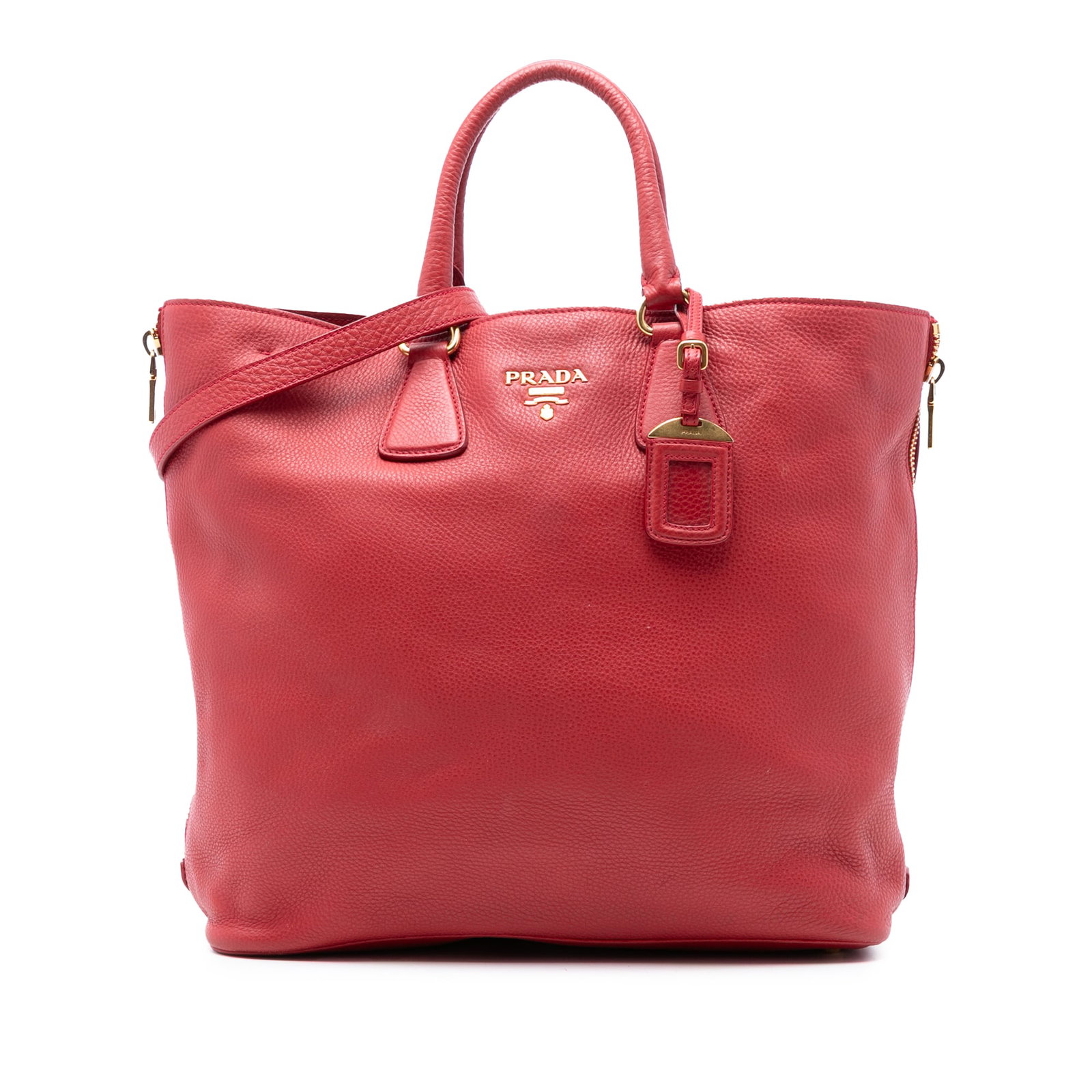 Prada Vitello Daino Red Leather Side Zip Tote Bag: Prada Vitello Daino Red Leather Side Zip Tote Bag Introducing the Prada Vitello Daino Side Zip Shopper Tote, a stylish and functional addition to your bag collection. This chic satchel features a luxu