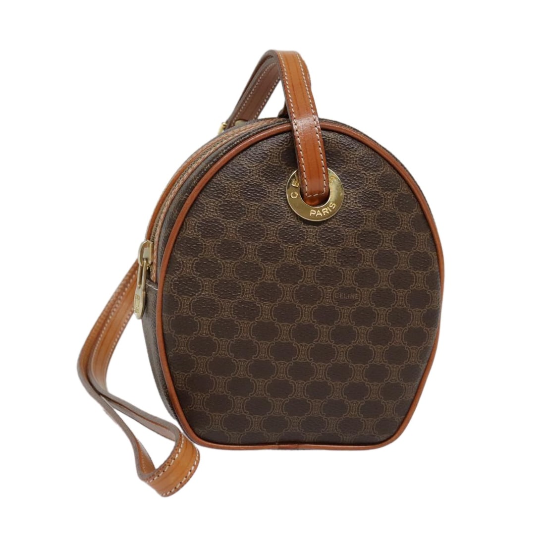 Celine Macadam Circle Logo Canvas Shoulder Bag: Celine Macadam Circle Logo Canvas Shoulder Bag This Celine Vintage Macadam Circle Logo Shoulder Bag features a classic brown canvas exterior with leather accents and the iconic circle logo. Designed f