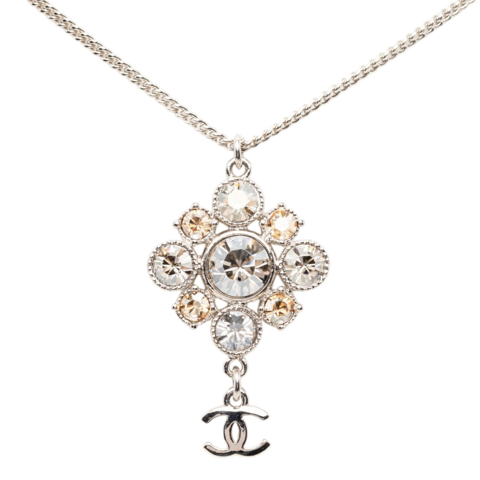 Chanel Silver Plated Crystal Pendant Necklace CC Brass Strass: Chanel Silver Plated Crystal Pendant Necklace CC Brass Strass This Chanel CC Brass Strass Pendant Necklace features a silver-plated chain and pendant adorned with crystal embellishments. The necklace 