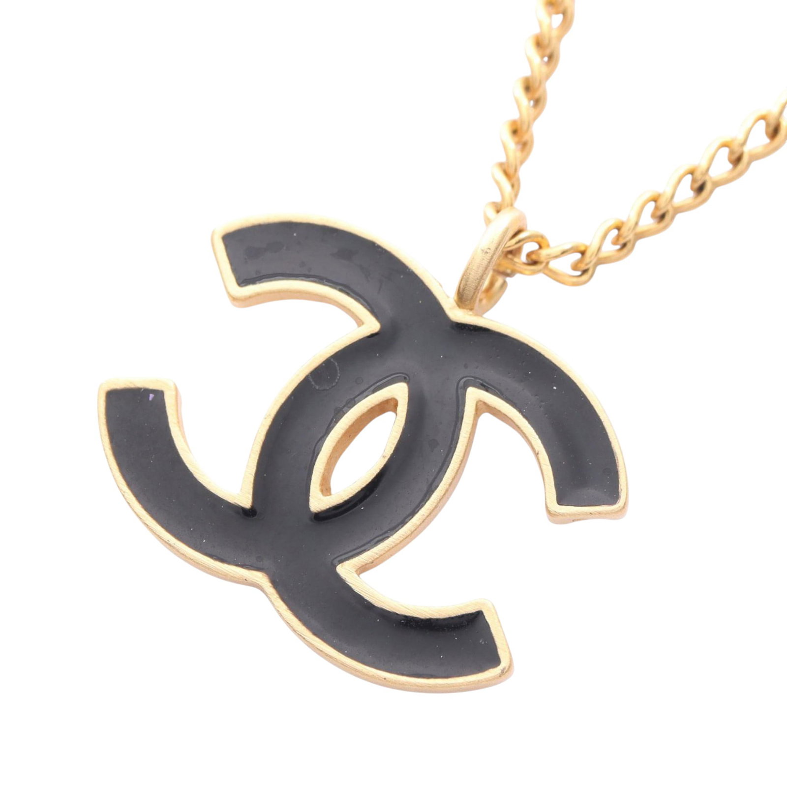 Chanel black enamel CC pendant necklace gold plated: Chanel black enamel CC pendant necklace gold plated This Chanel necklace features a gold-plated body with a black enamel CC pendant crafted in gold tone metal. It is designed with a lobster clasp clos
