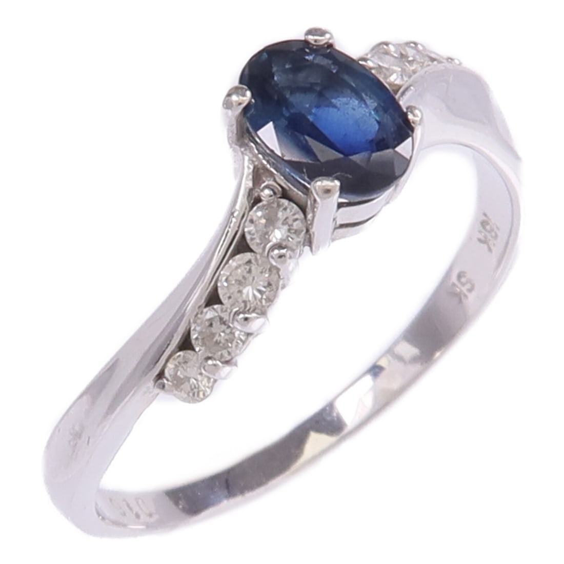 Sapphire and Diamond 18K White Gold Ring Size 7.25: Sapphire and Diamond 18K White Gold Ring Size 7.25 This ring features a blue sapphire as the main stone, set in 18K white gold. The ring is designed in a regular size US 7.25 and displays reasonable w