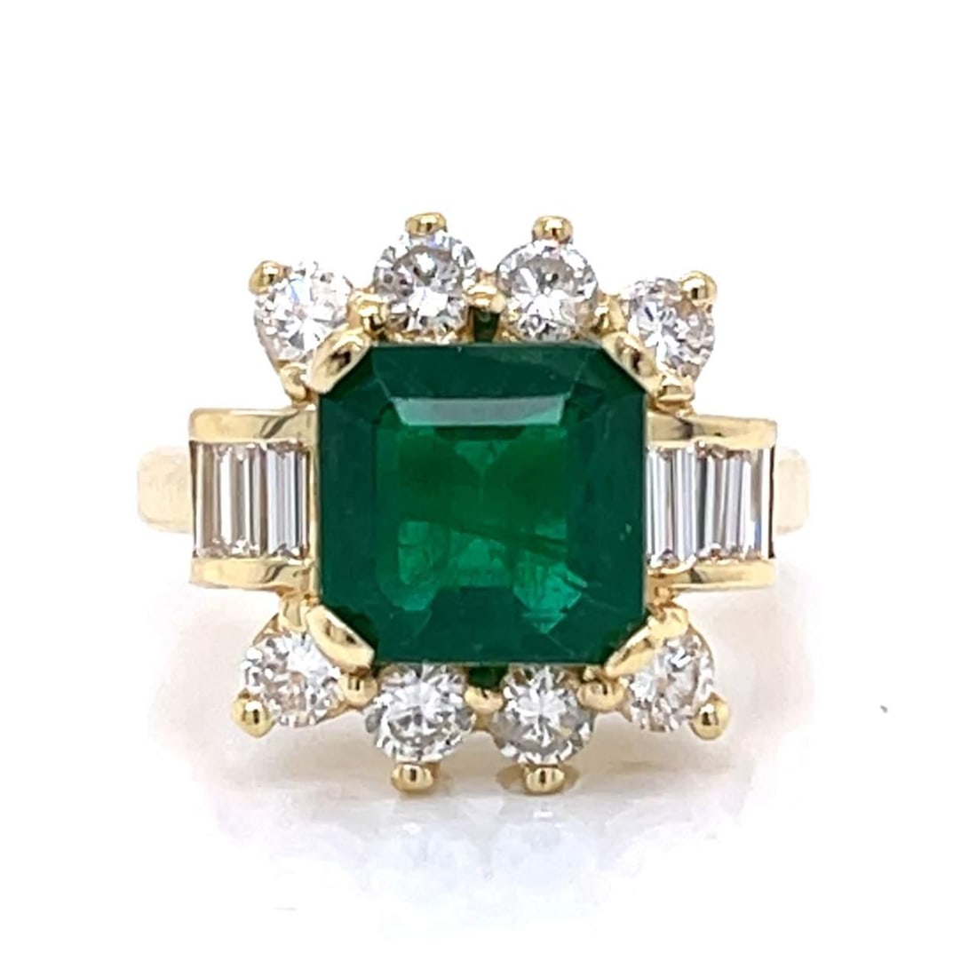 18K Yellow Gold Emerald 3.00 Ct Diamond Ring with 14 Diamonds: 18K Yellow Gold Emerald 3.00 Ct Diamond Ring with 14 Diamonds This exquisite 18K yellow gold ring features a stunning approximately 3.00 Ct emerald, beautifully complemented by 14 diamonds with a tota