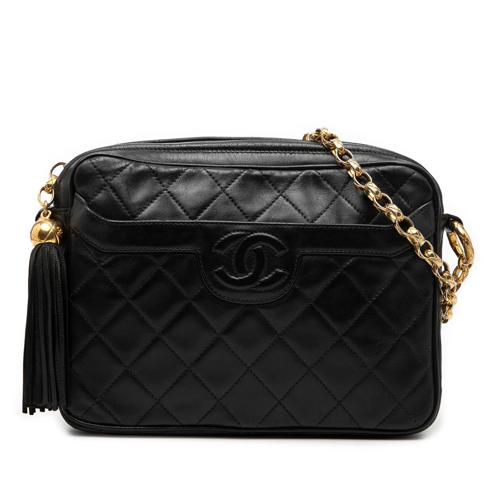 Chanel lambskin quilted camera crossbody with tassel CC: Chanel lambskin quilted camera crossbody with tassel CC This Chanel CC Quilted Lambskin Tassel Camera Bag features a black quilted lambskin leather body, complemented by a gold-tone chain link strap a