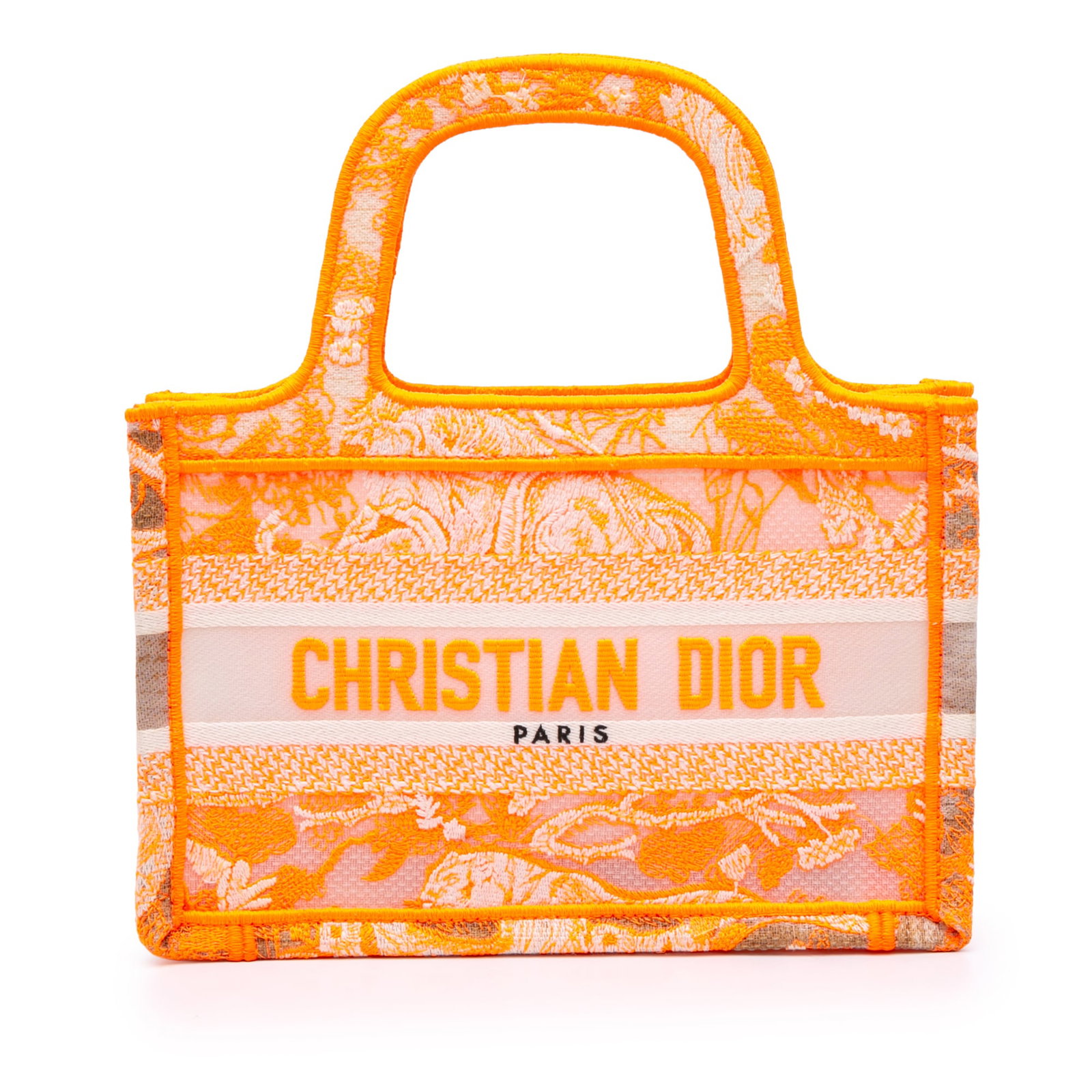 Dior Mini Book Tote Orange Embroidered Canvas Dioriviera Toile De Jouy Bag: Dior Mini Book Tote Orange Embroidered Canvas Dioriviera Toile De Jouy Bag This Mini Book Tote features an embroidered canvas body with flat top handles and an open top design. The bag showcases the D