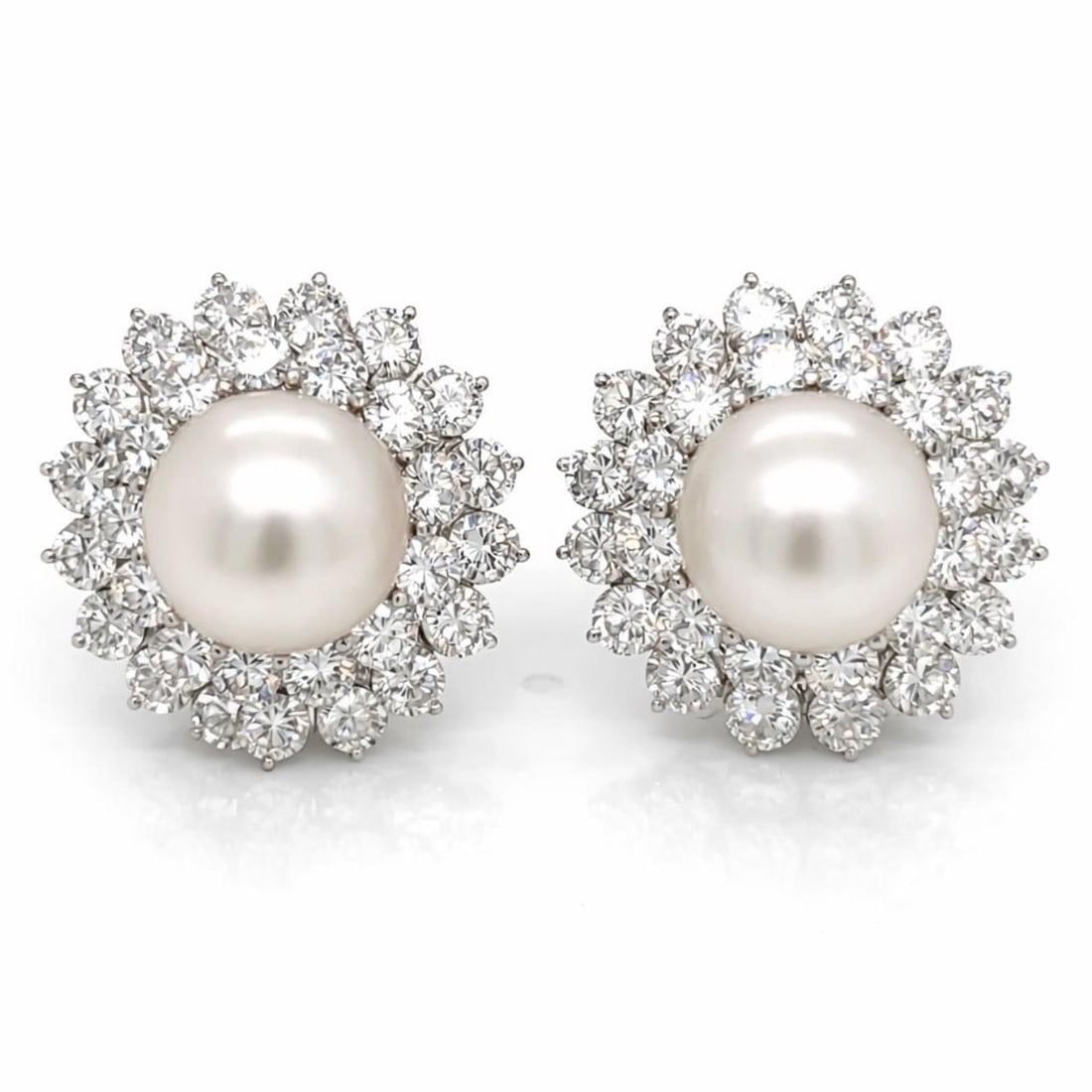 South Sea Pearl and Diamond Earrings in 18K White Gold: South Sea Pearl and Diamond Earrings in 18K White Gold These elegant earrings are crafted from 18K white gold and feature two South Sea pearls, each measuring 12.7mm. The earrings are set with a total