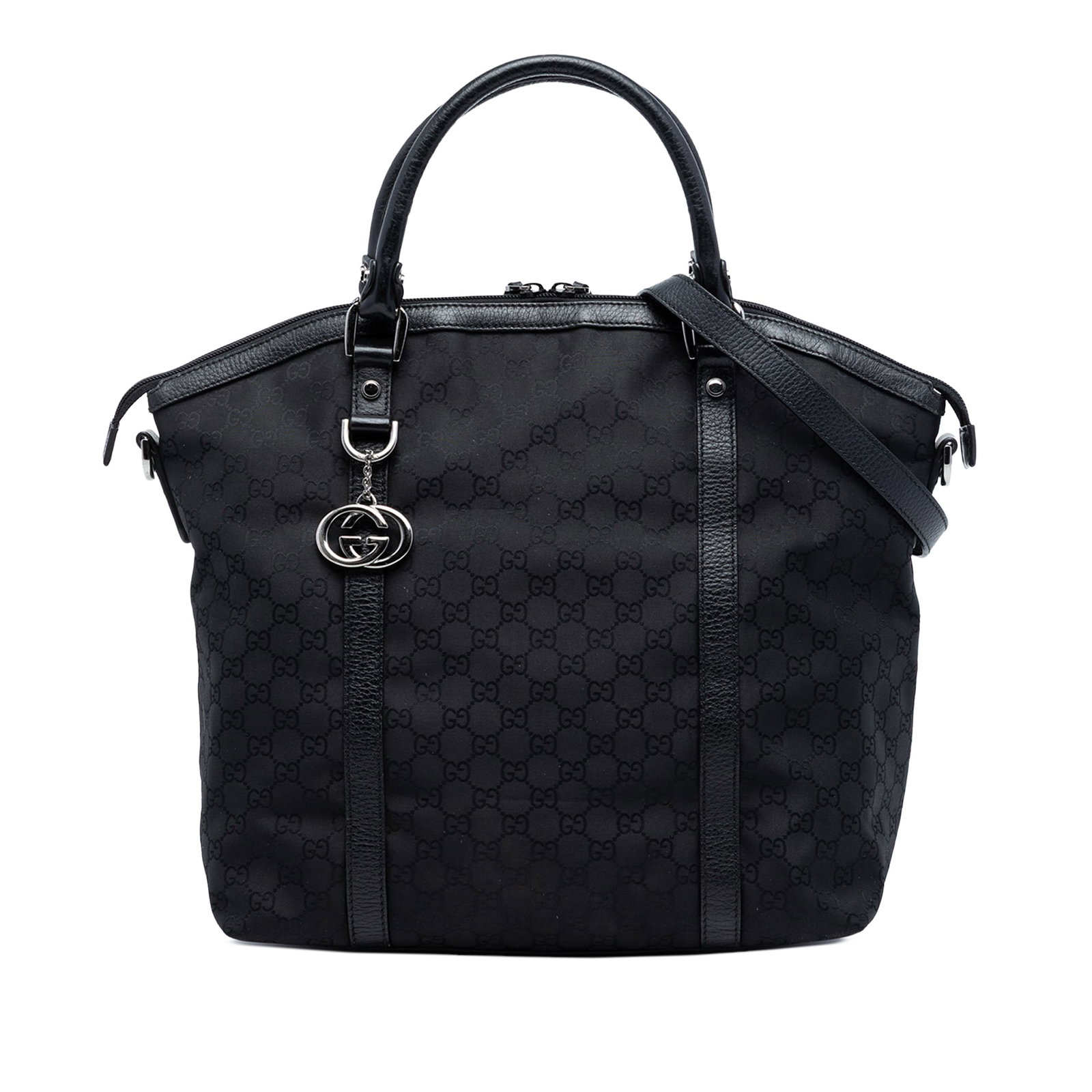 Gucci Black Nylon Dome Satchel with Leather Trim and Charm: Gucci Black Nylon Dome Satchel with Leather Trim and Charm This Gucci Large GG Canvas Charm Dome Satchel features a nylon body with leather trim, rolled leather handles, a detachable flat leather stra