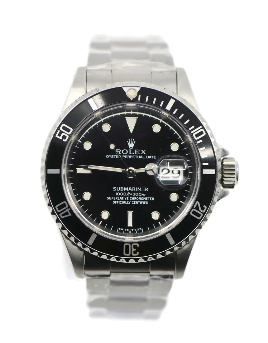 1995 Submariner 16610 Automatic Stainless Steel 40mm Wristwatch with Box: 1995 Submariner 16610 Automatic Stainless Steel 40mm Wristwatch with Box This Rolex Submariner 16610 is a pre-owned stainless steel wristwatch featuring a black bezel and black dial. Manufactured in 1