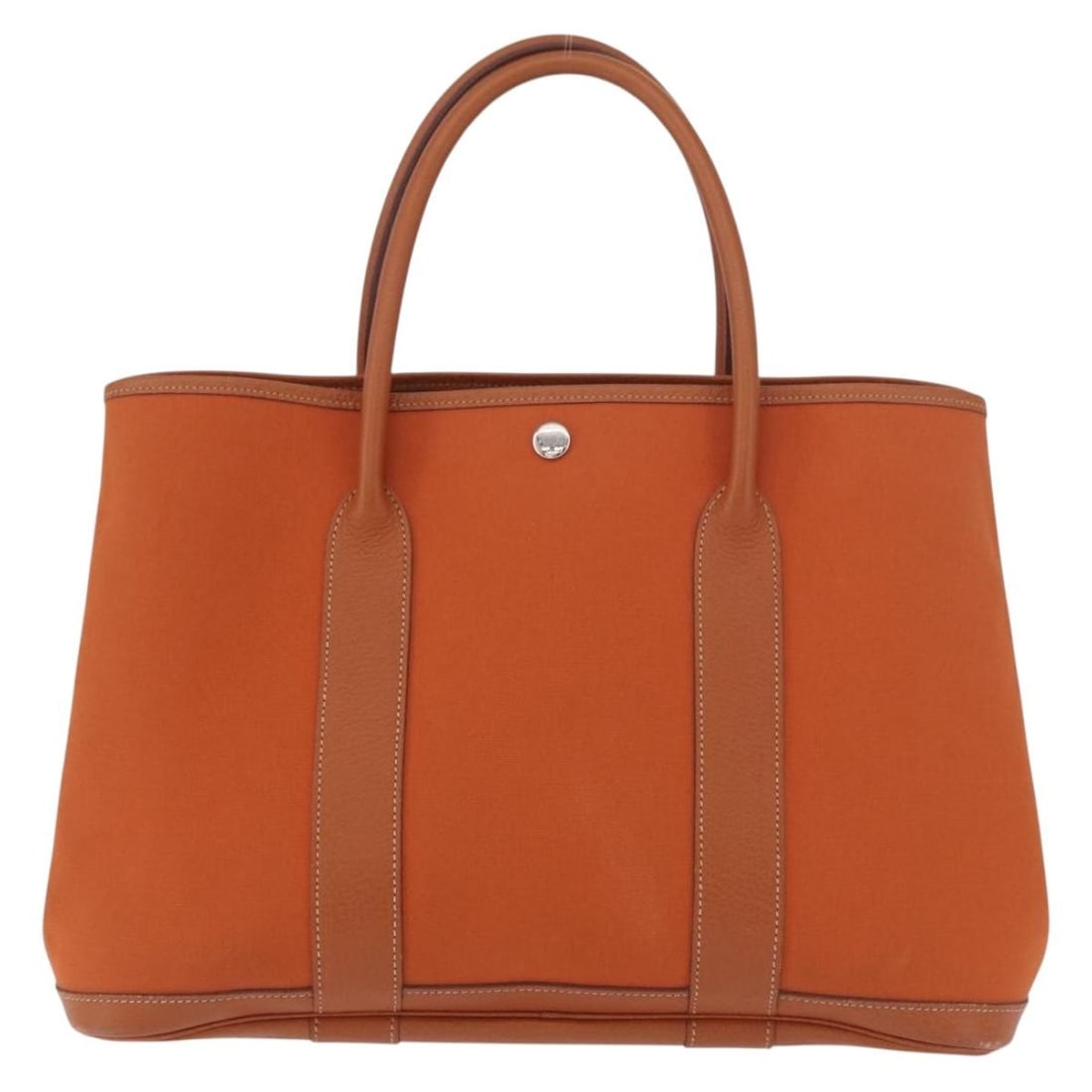 Hermes Garden Party orange canvas tote: Hermes Garden Party orange canvas tote This Hermes Garden Party Tote features a combination of orange canvas and leather, complemented by leather trim and handles. The bag is in good overall condition