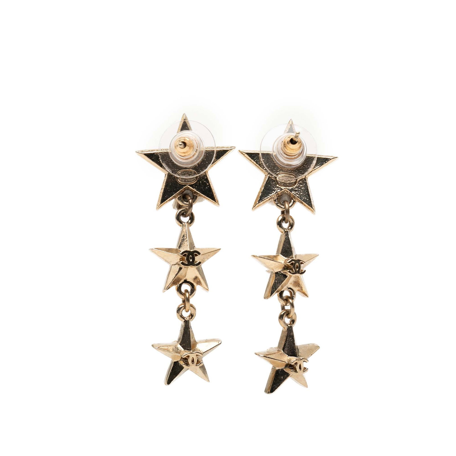 Chanel gold plated star drop earrings bullet back: Chanel gold plated star drop earrings bullet back These Chanel CC Gold Plated Triple Star Drop Bullet Back Earrings feature gold-tone hardware and a striking triple star drop design. Crafted from meta
