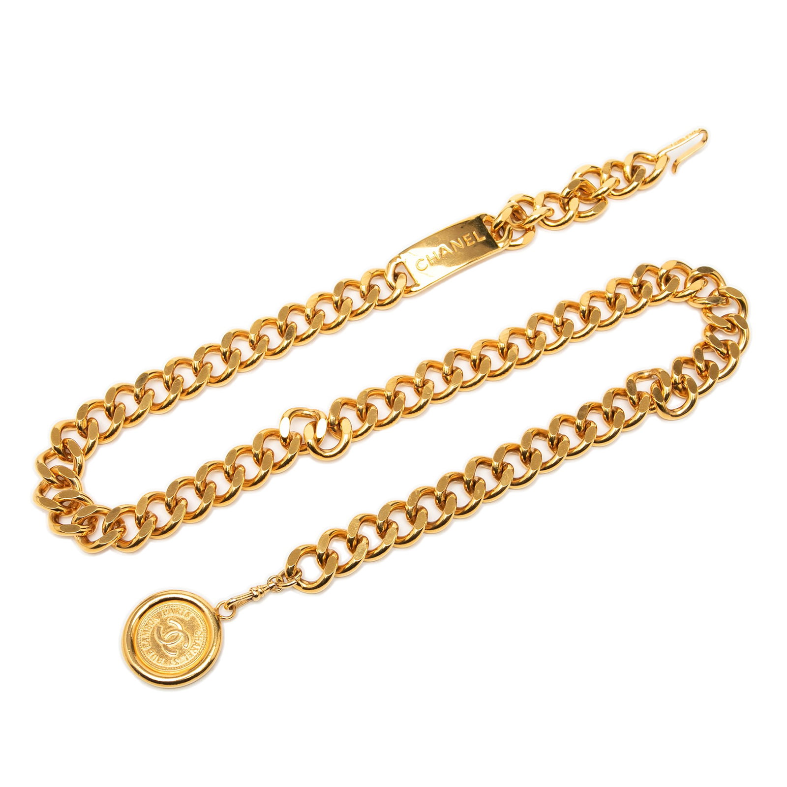 Chanel CC Medallion Chain Belt with Gold Plated Finish: Chanel CC Medallion Chain Belt with Gold Plated Finish This Chanel Medallion chain-link belt features a gold-plated metal body with an engraved CC logo. The design includes a gold-tone curb chain and 