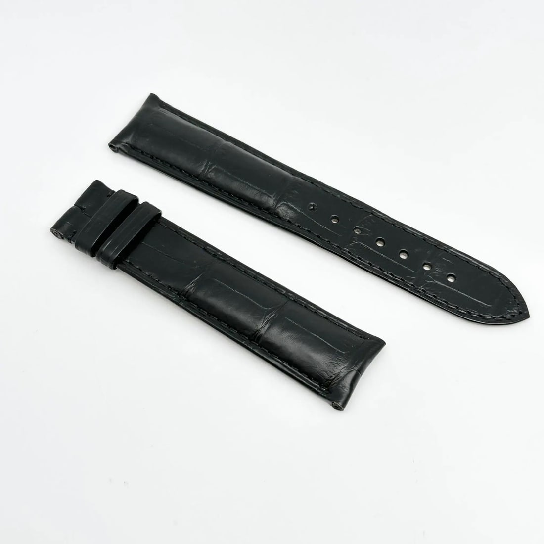 Cartier 20x18mm Black Alligator Leather Two-Piece Watch Band: Cartier 20x18mm Black Alligator Leather Two-Piece Watch Band This exquisite Cartier wristwatch band is crafted from luxurious black alligator leather, measuring 20 x 18 mm. Designed as a two-piece str